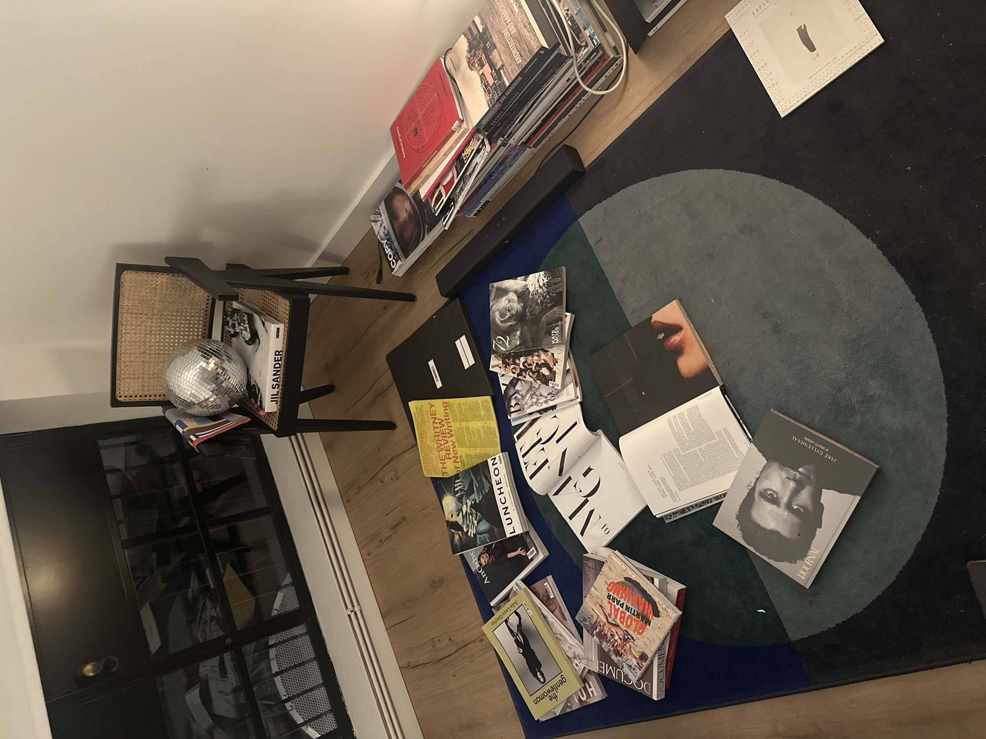 London resident enjoys evening reading session with art magazines, tea