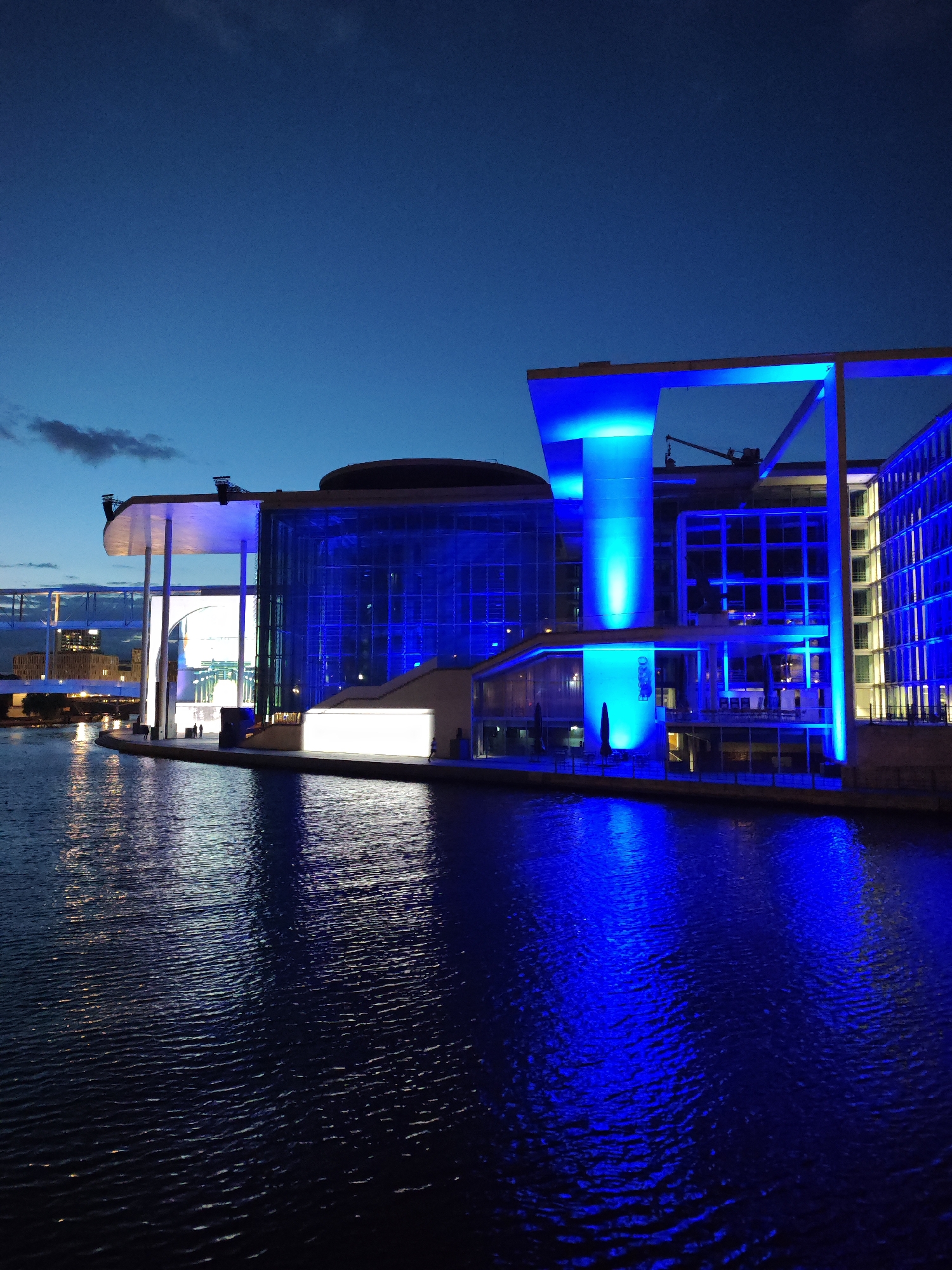 Berlin's Spree riverfront lit up on a summer evening