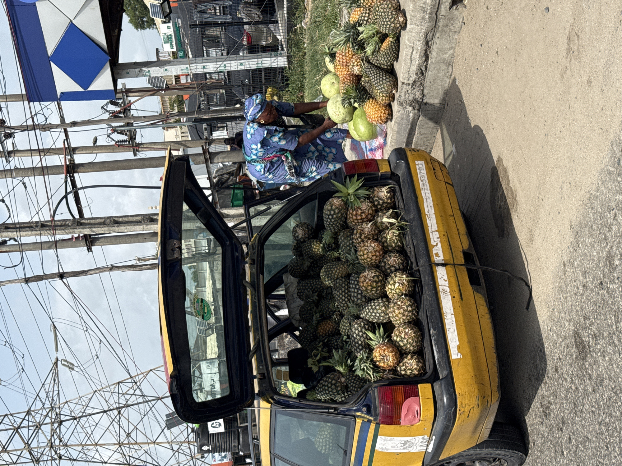 Woman operates fruit stand in Lekki, Nigeria