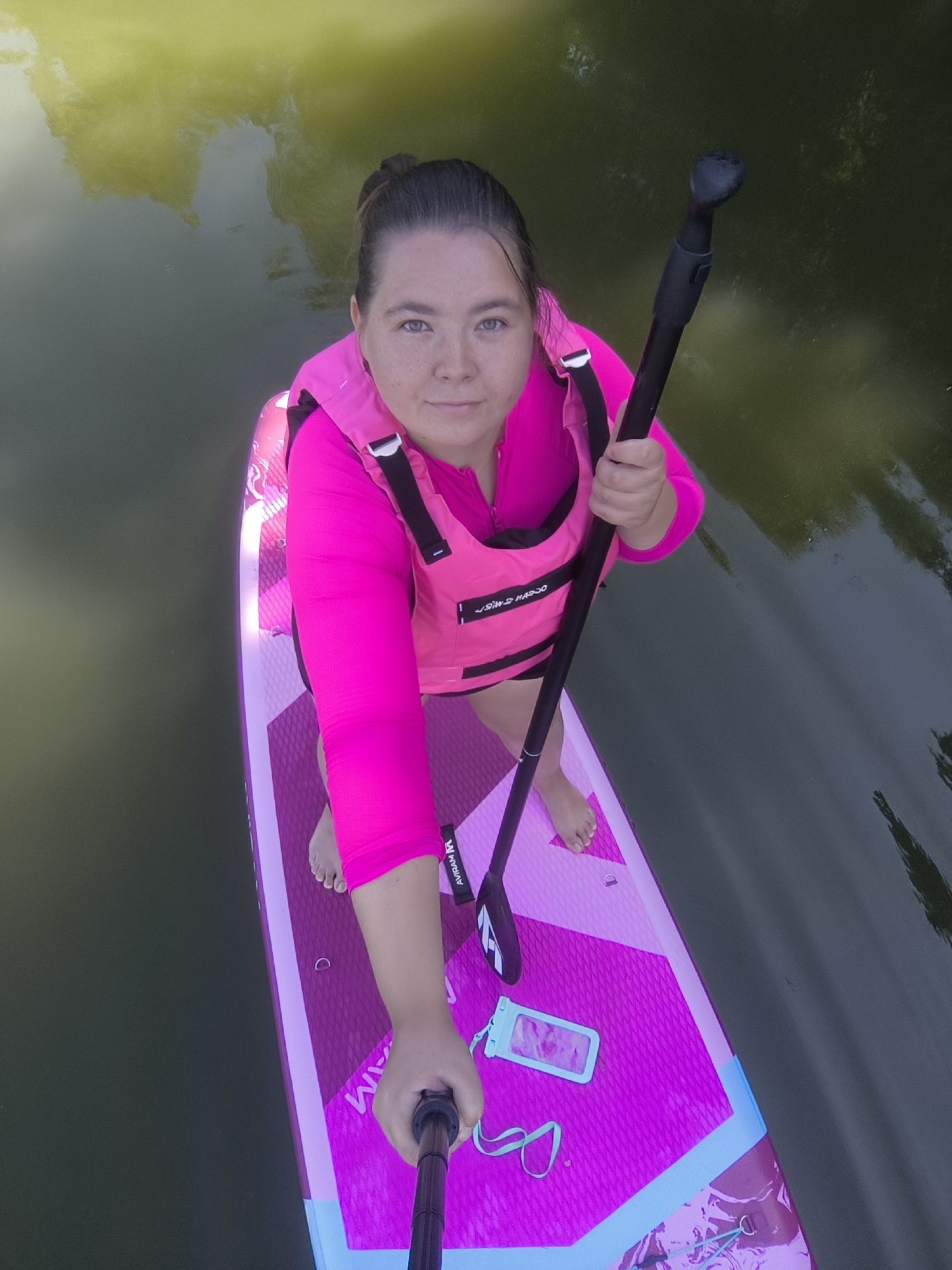 Pink paddleboard session on calm Kaliningrad waters
