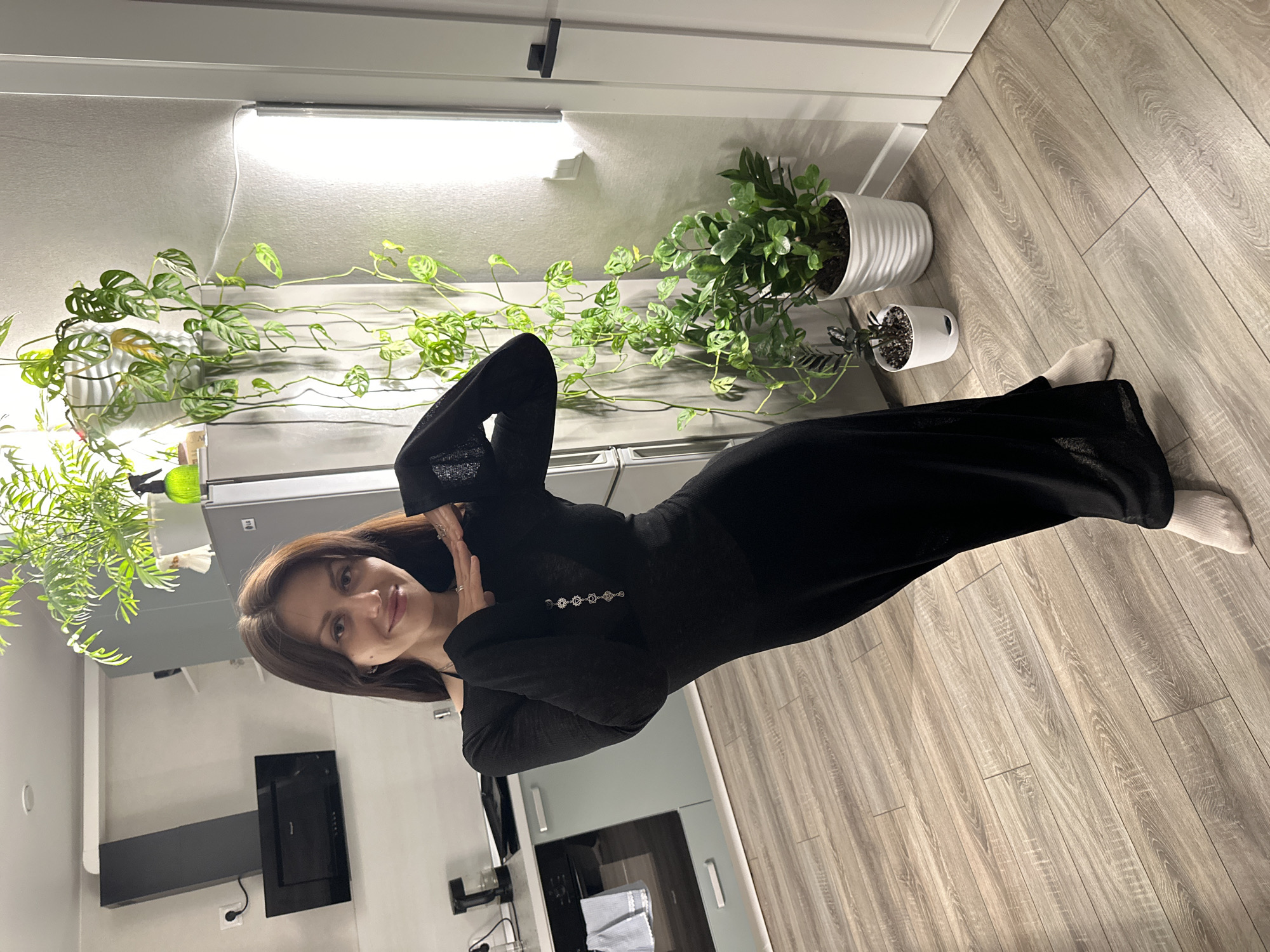 Woman photographed in modern kitchen space in Murino, Russia