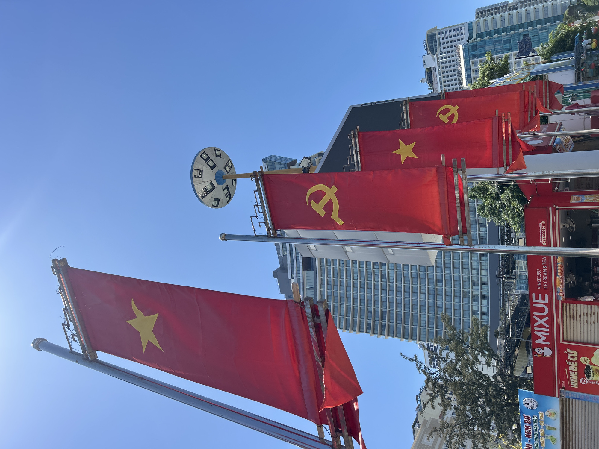 Vietnamese flags displayed along Nha Trang Ward street