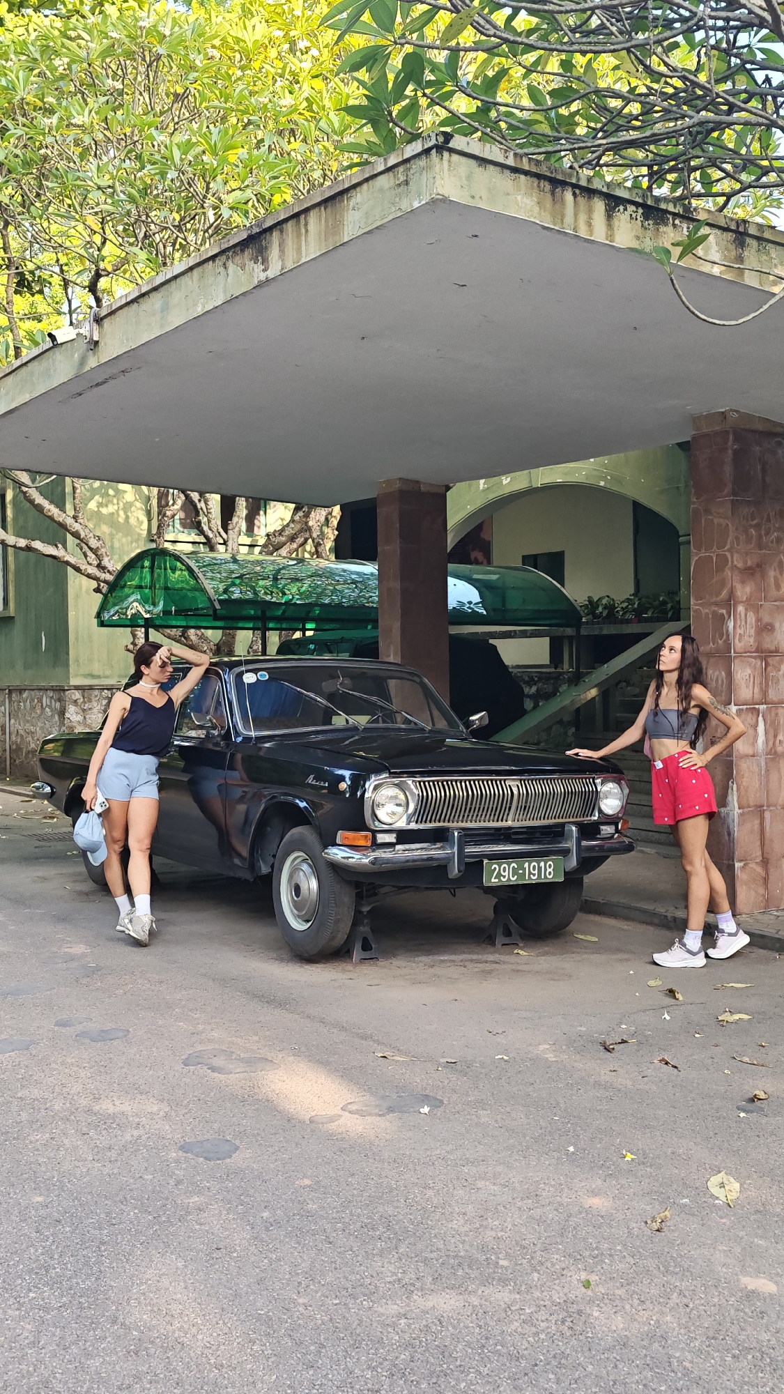 Tourists explore historical sites and vintage vehicles in Hà Nội