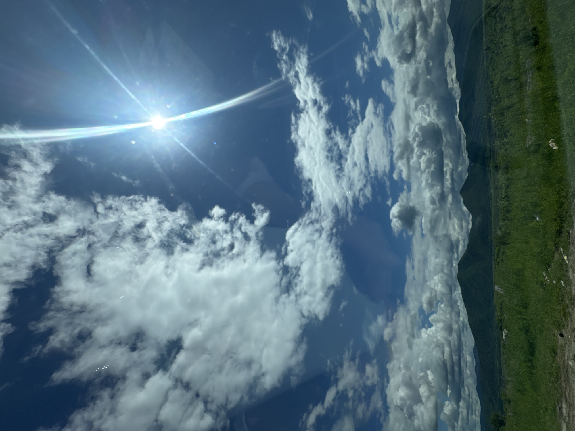 Sunny summer drive through green mountain terrain near Теплоозёрск