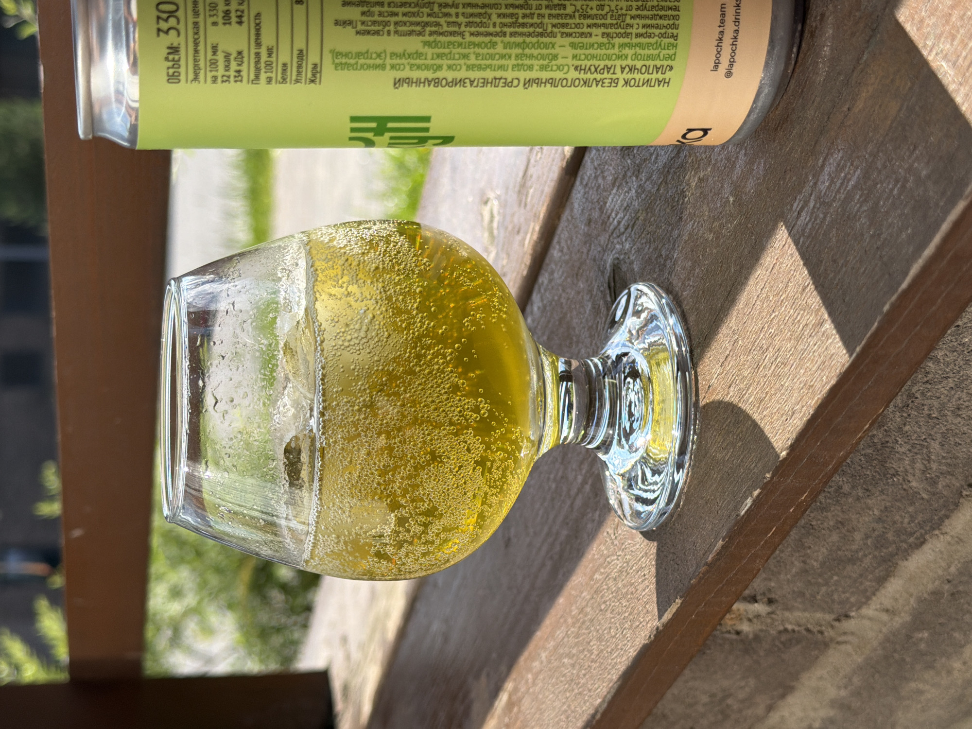 Sparkling yellow drink and LAPOCHKA TARHUN can in Strelna