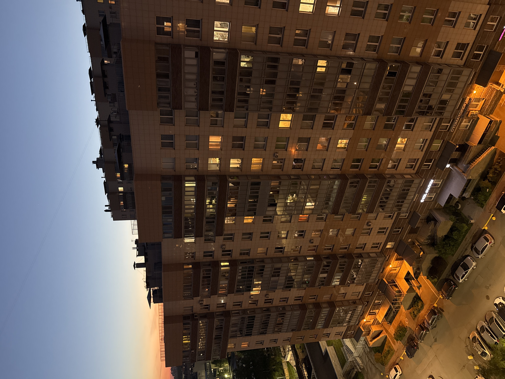 Modern residential building photographed at twilight in Russia