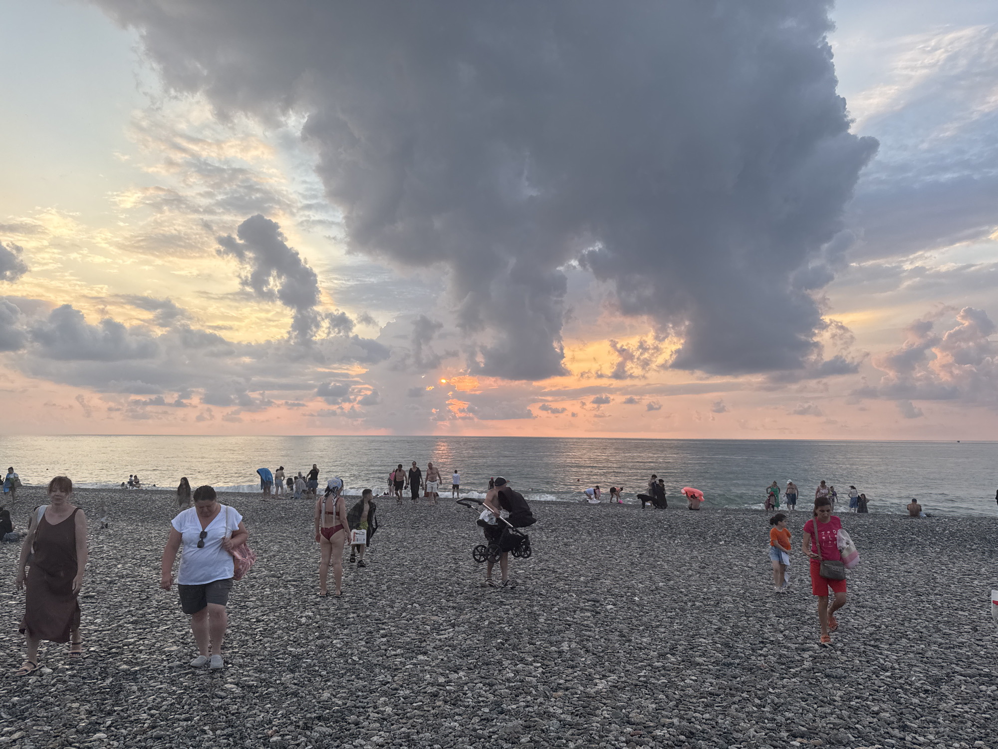 Batumi's waterfront at sunset: beach, promenade, and landmarks