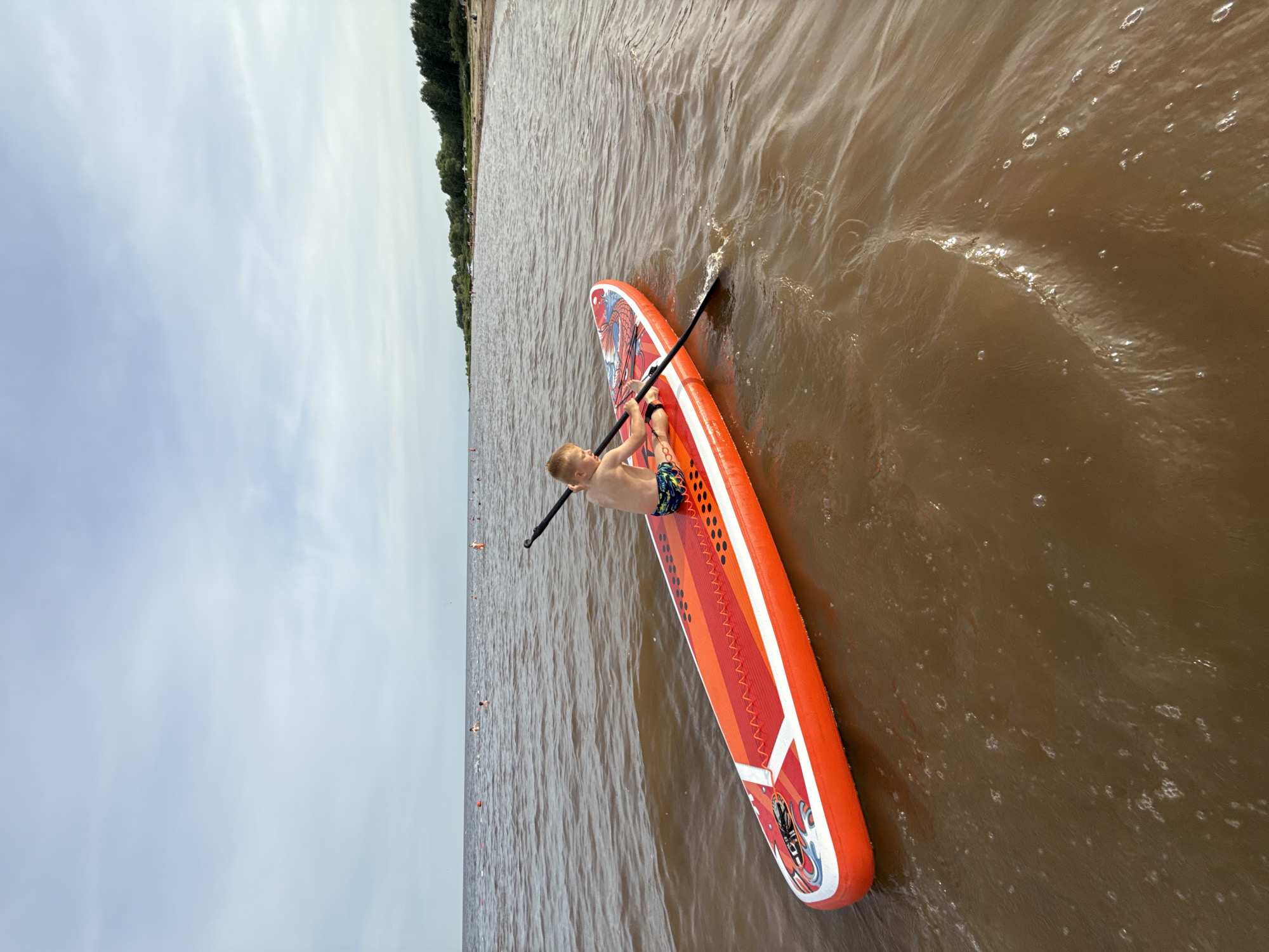 Lazy beach afternoon in Ondvor with paddleboards and a dog