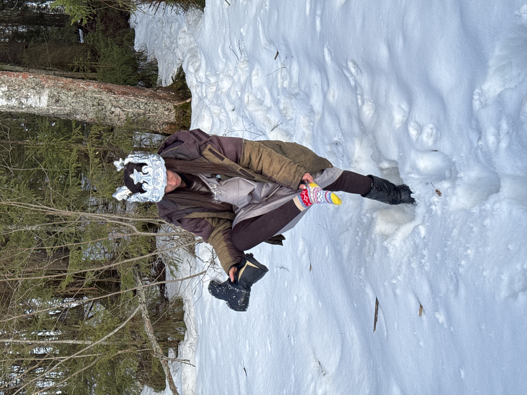 Woman plays with decorated eggs in snowy Russian village
