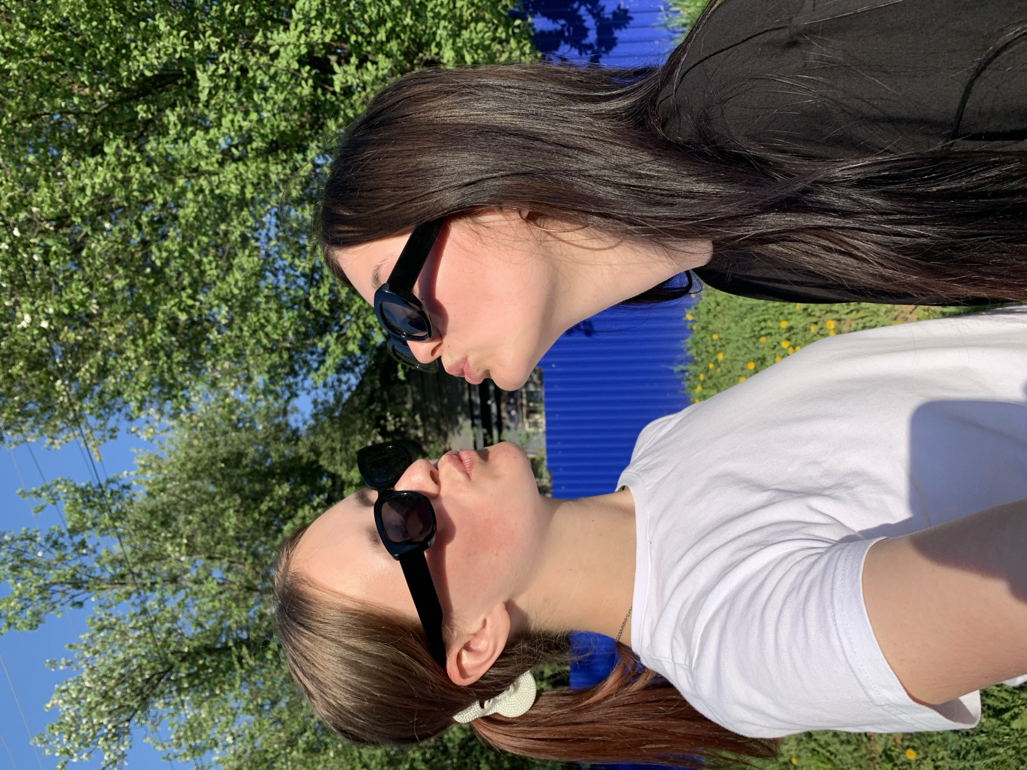 Two women take playful photos in Фоки Russia