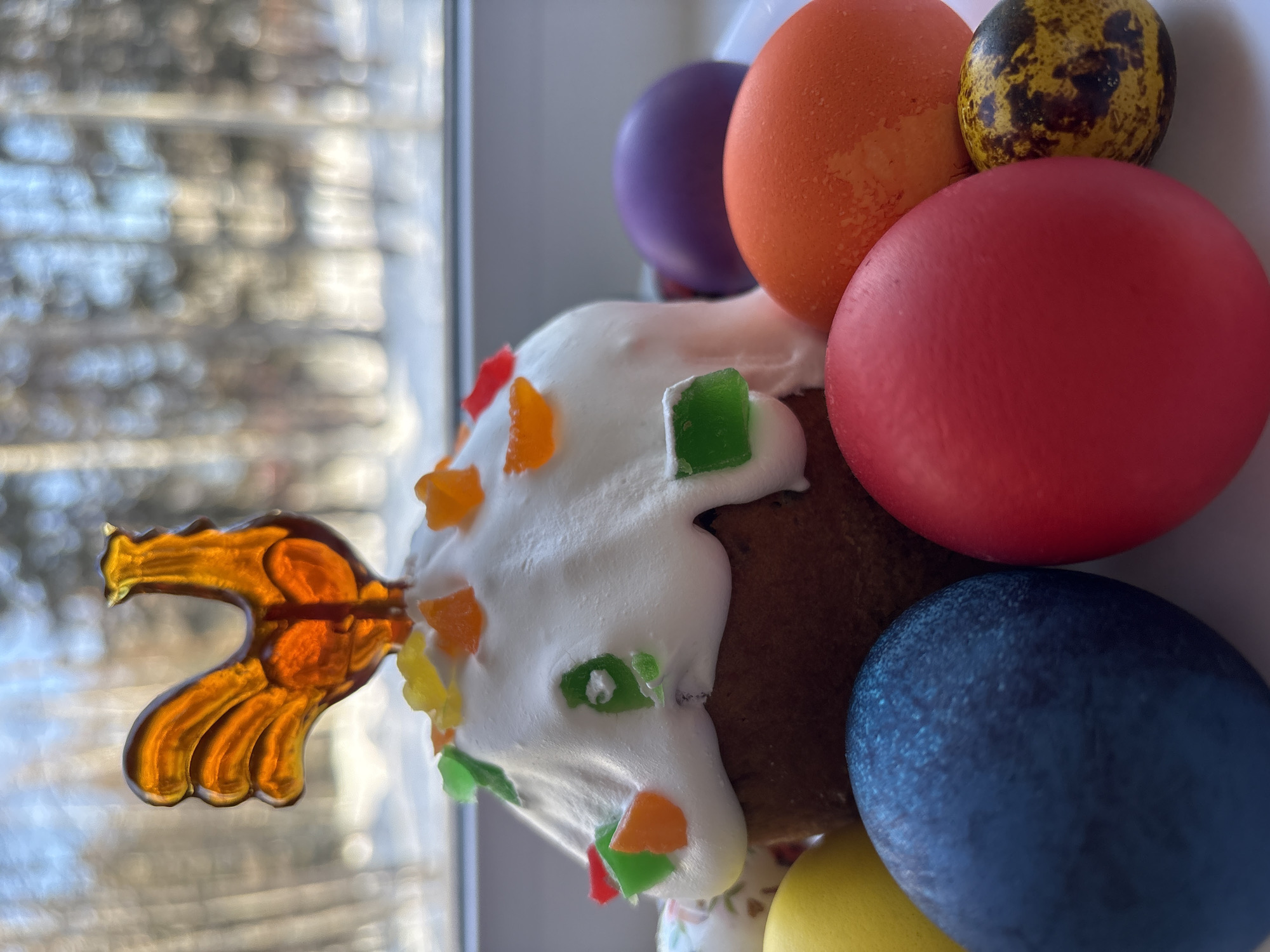 Easter traditions observed in Ust-Ilimsk with decorated cake, colored eggs