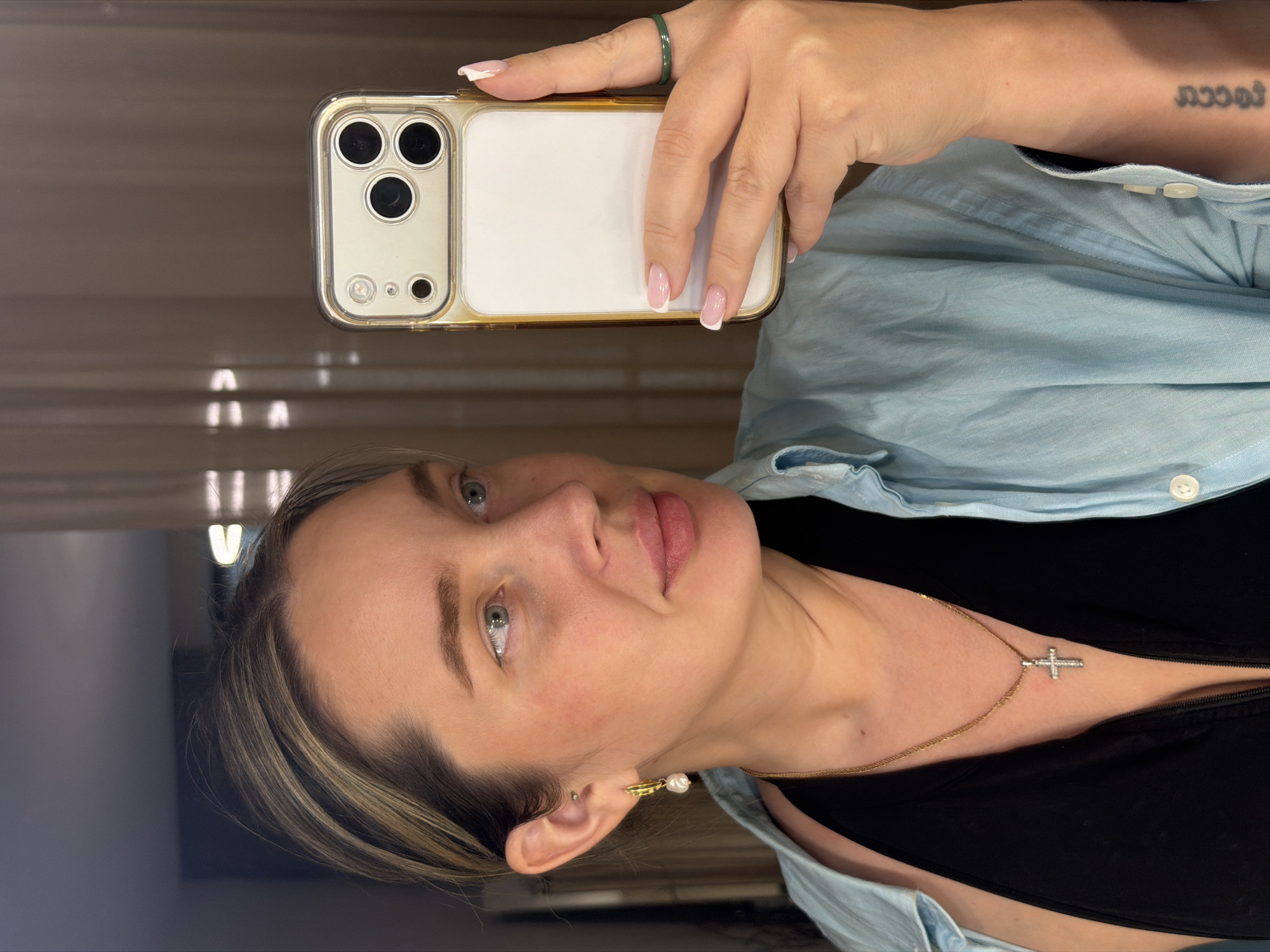 Woman takes selfie with multi-camera smartphone
