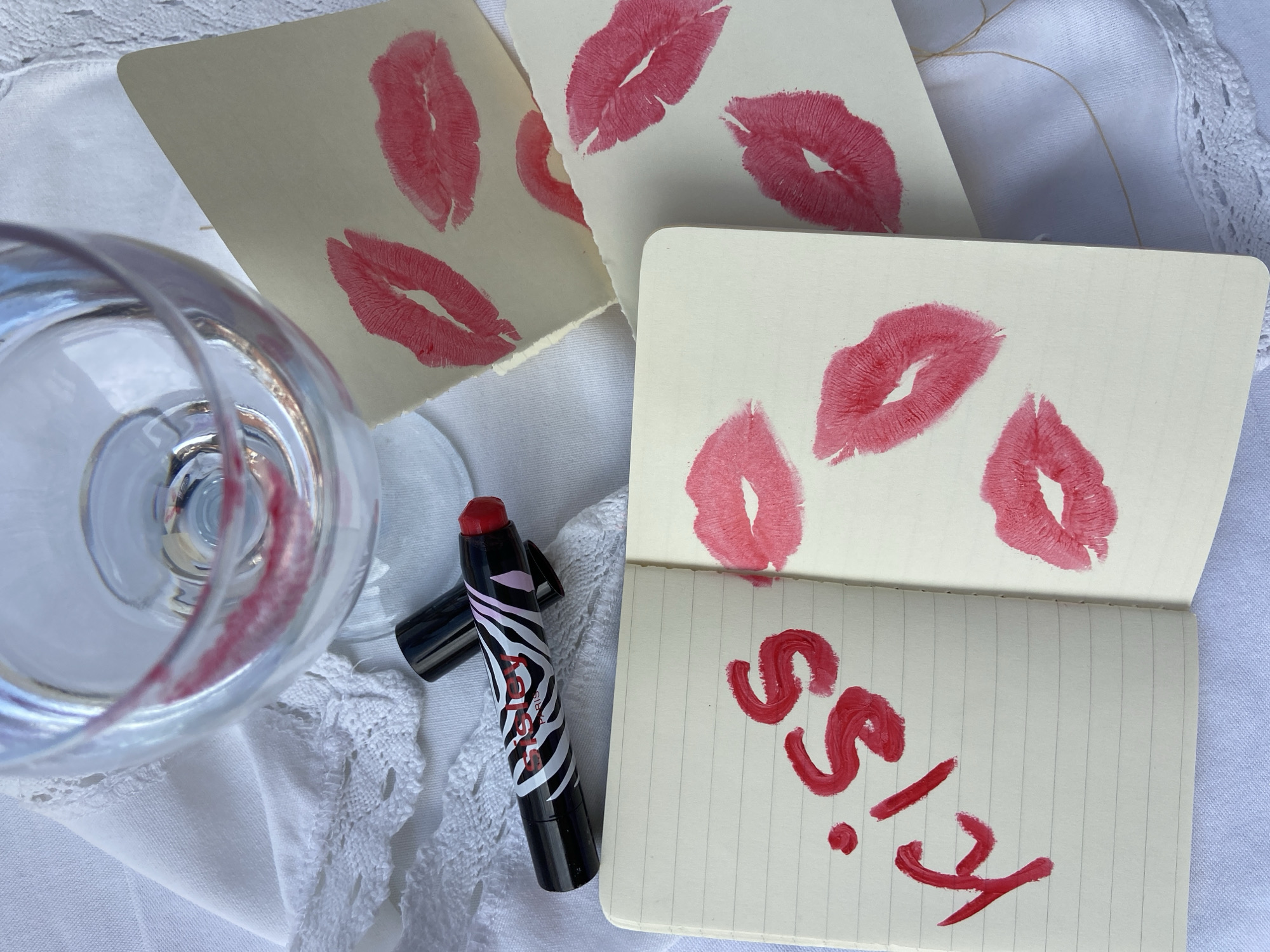 Artist documents lipstick kiss impressions in Budva, Montenegro
