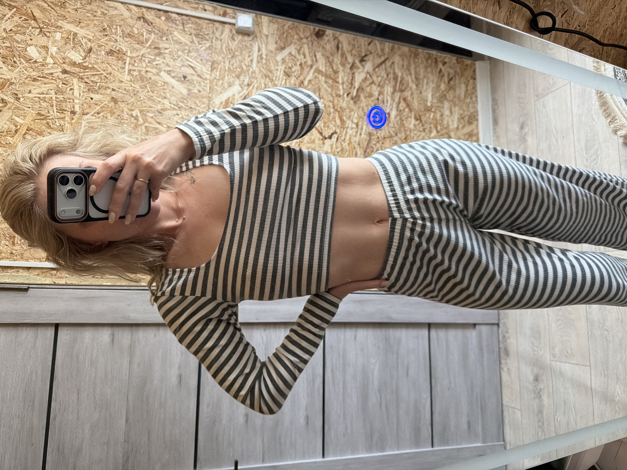 Woman takes mirror selfies in bathroom, Chaikovsky Russia
