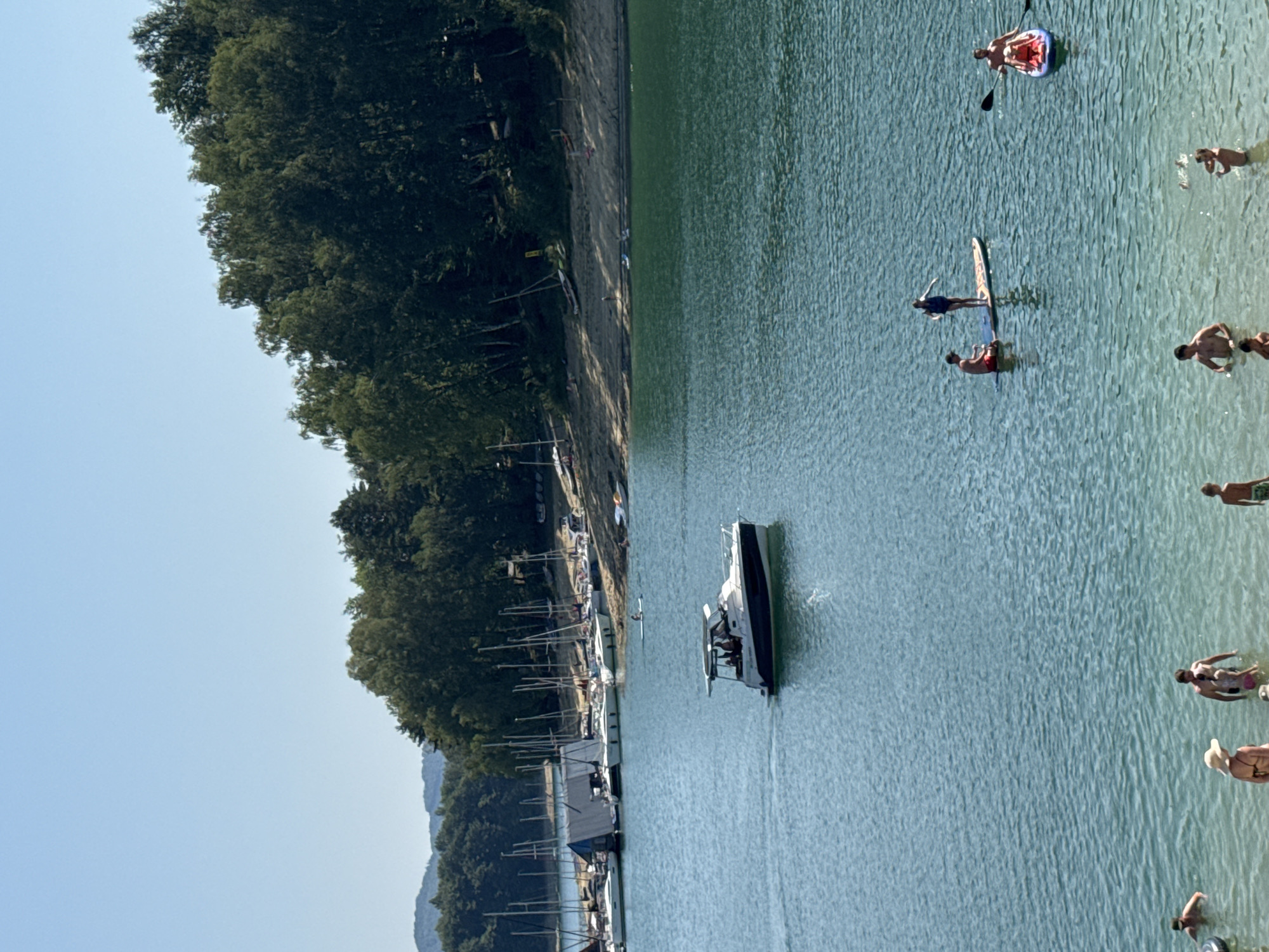 Summer crowds fill Lake Solina's beach and marina in Polańczyk