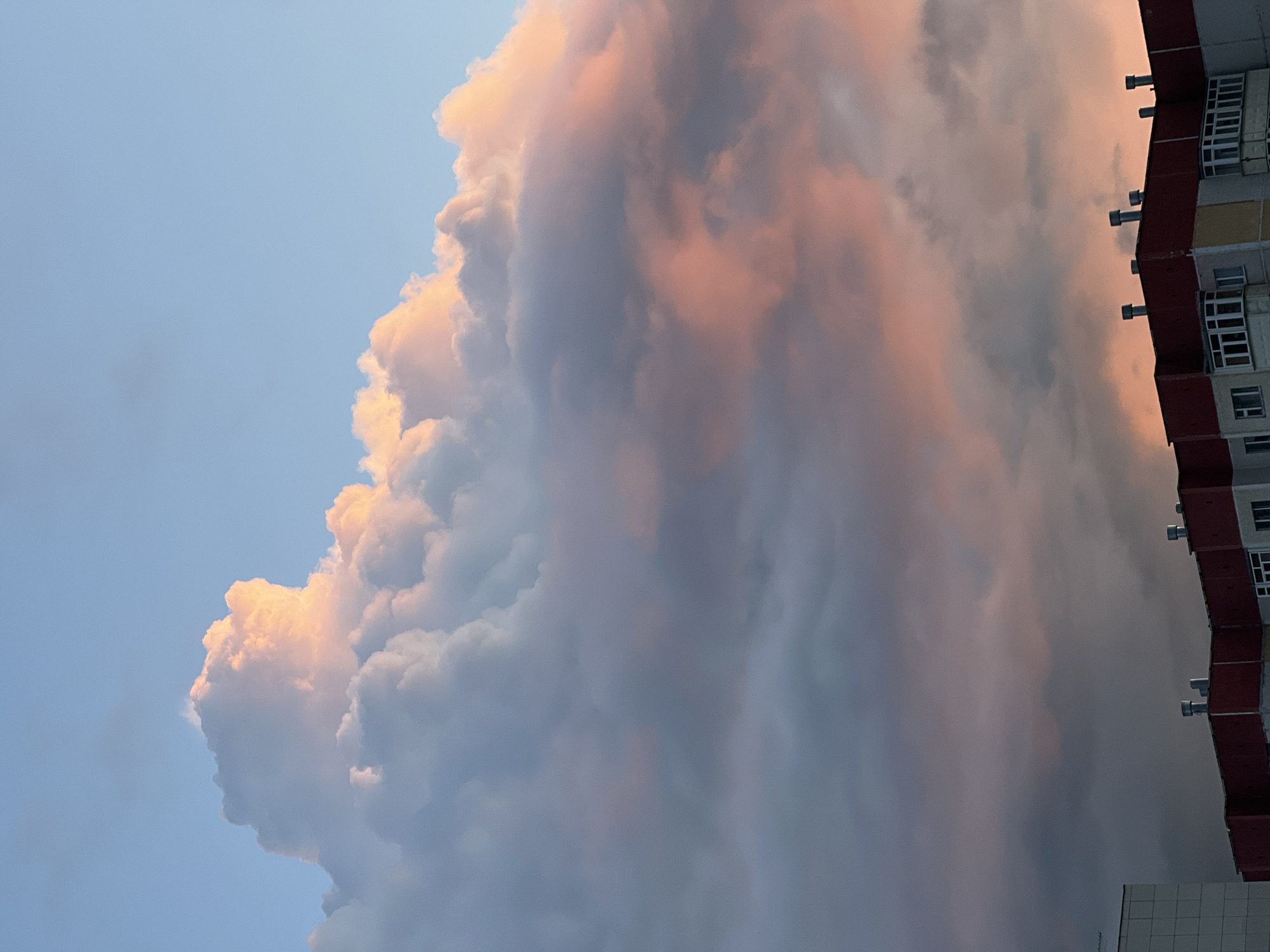 Sunset clouds and crescent moon over Surgut, Russia
