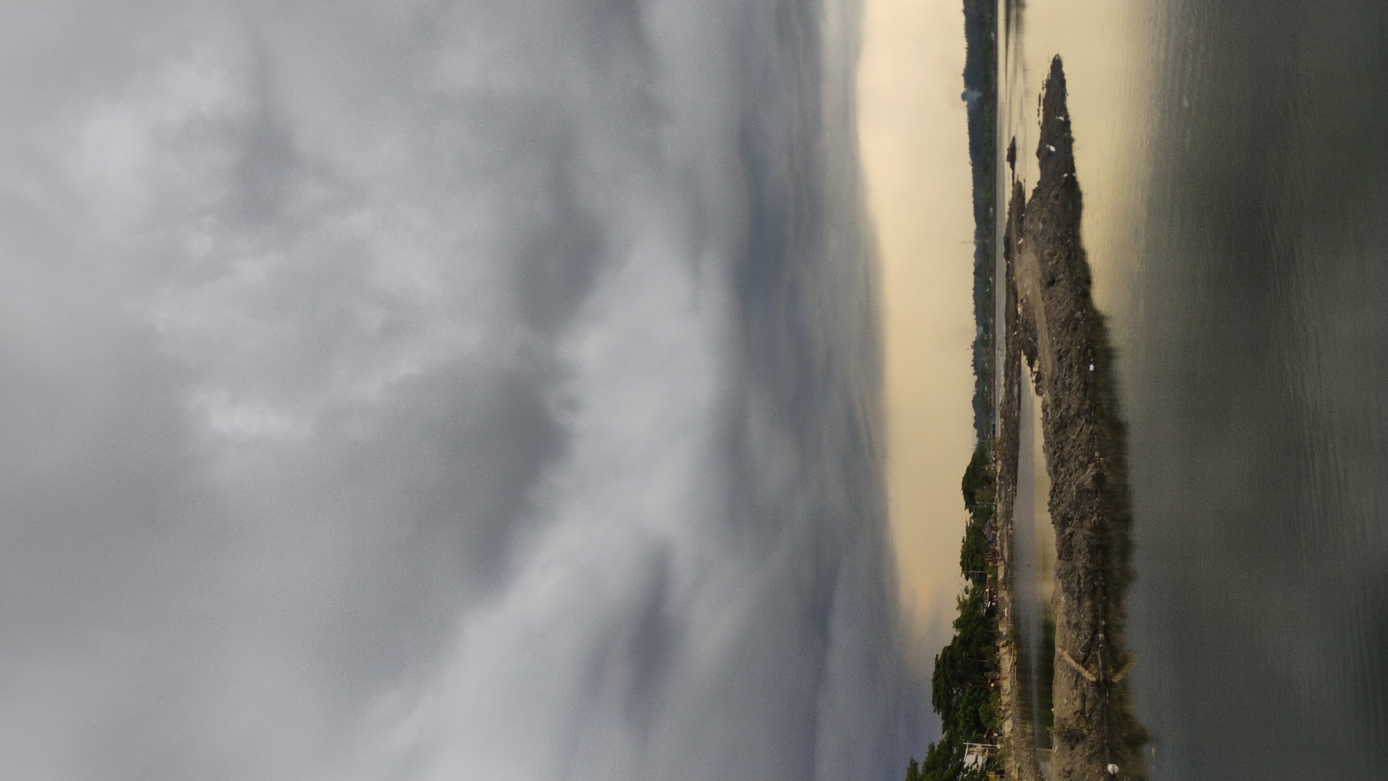 Stormy skies over Lhokseumawe's waterfront and estuary