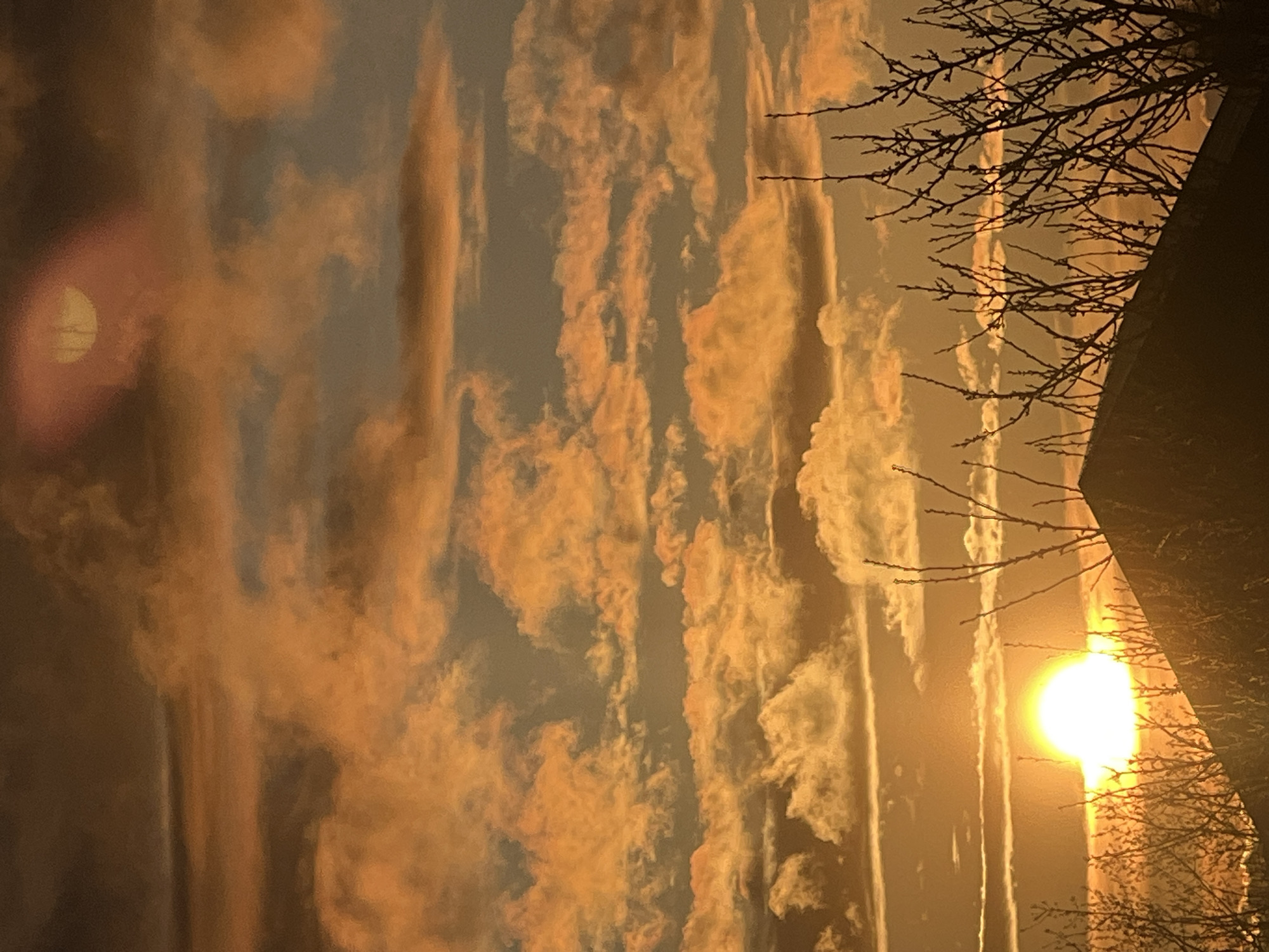 Sunset illuminates Riga skyline with orange clouds April 25