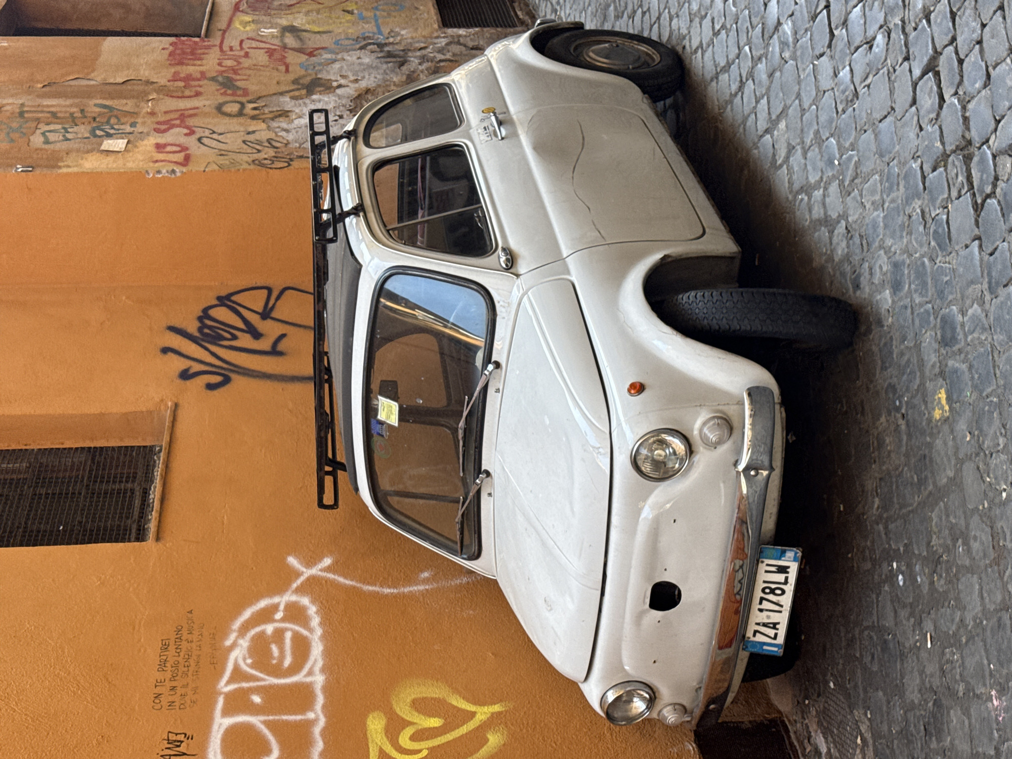 Witness captures typical Roman street scene with parked Fiat