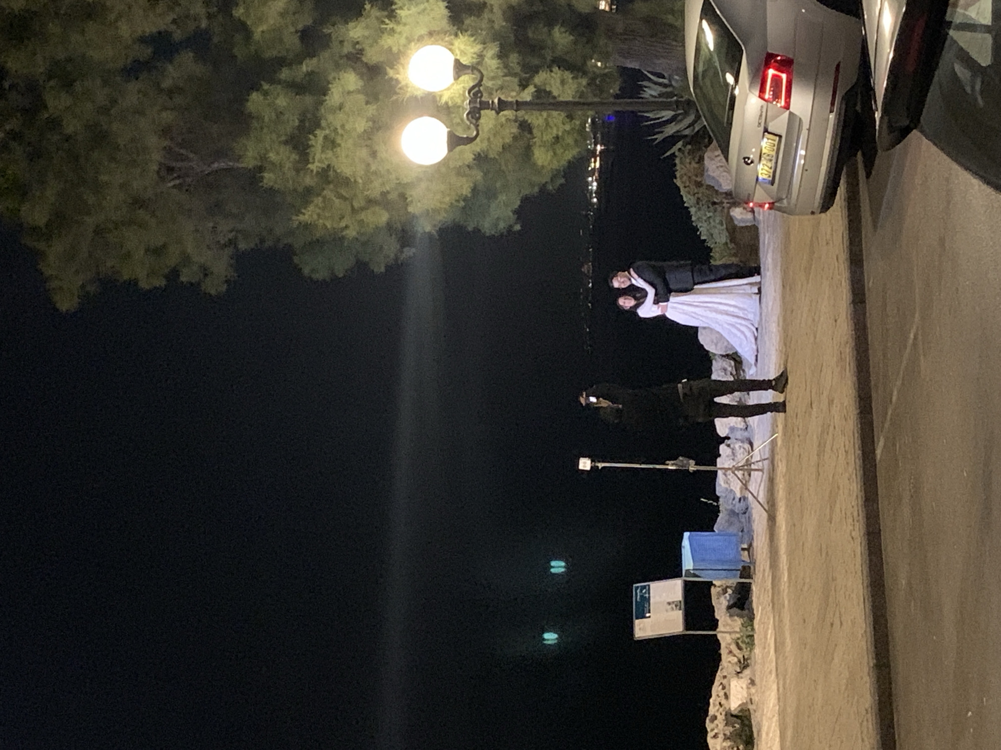 Outdoor wedding ceremony held on illuminated Tel Aviv street