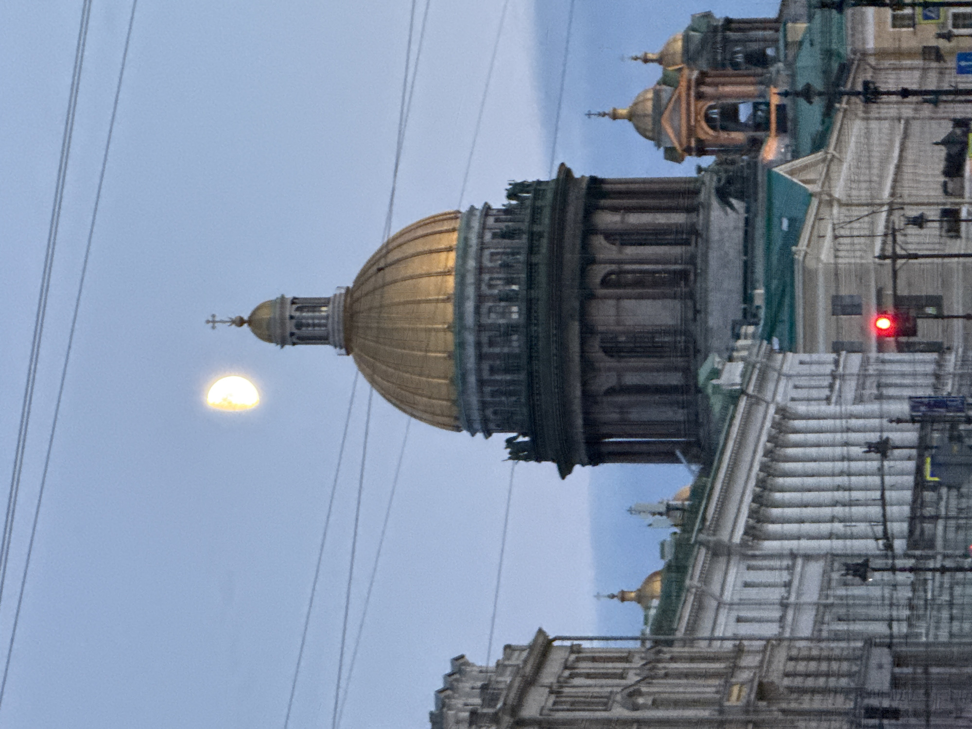 Live performances and street scenes fill Palace Square at dusk