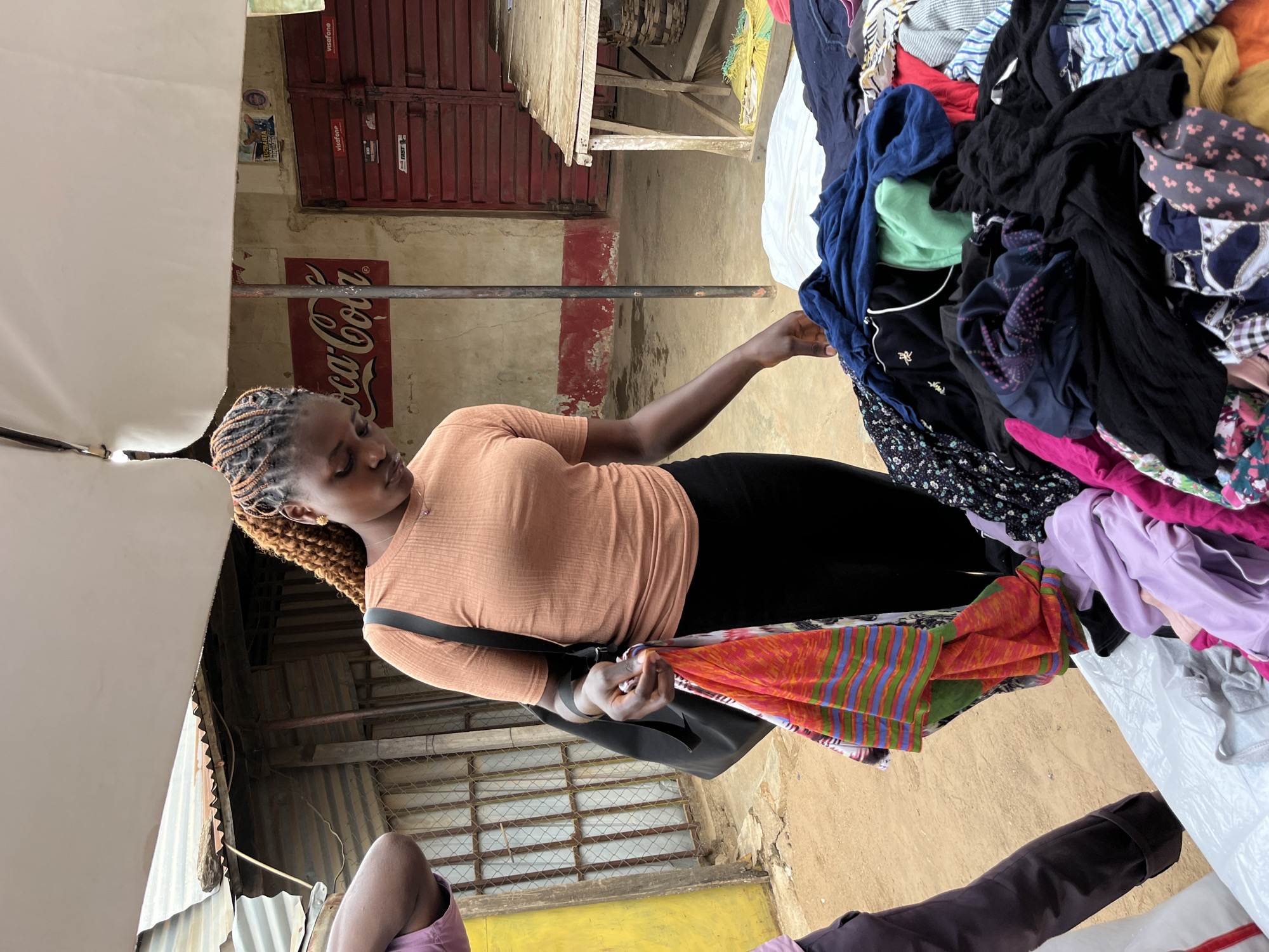 Busy afternoon at secondhand clothing market in Gura Top