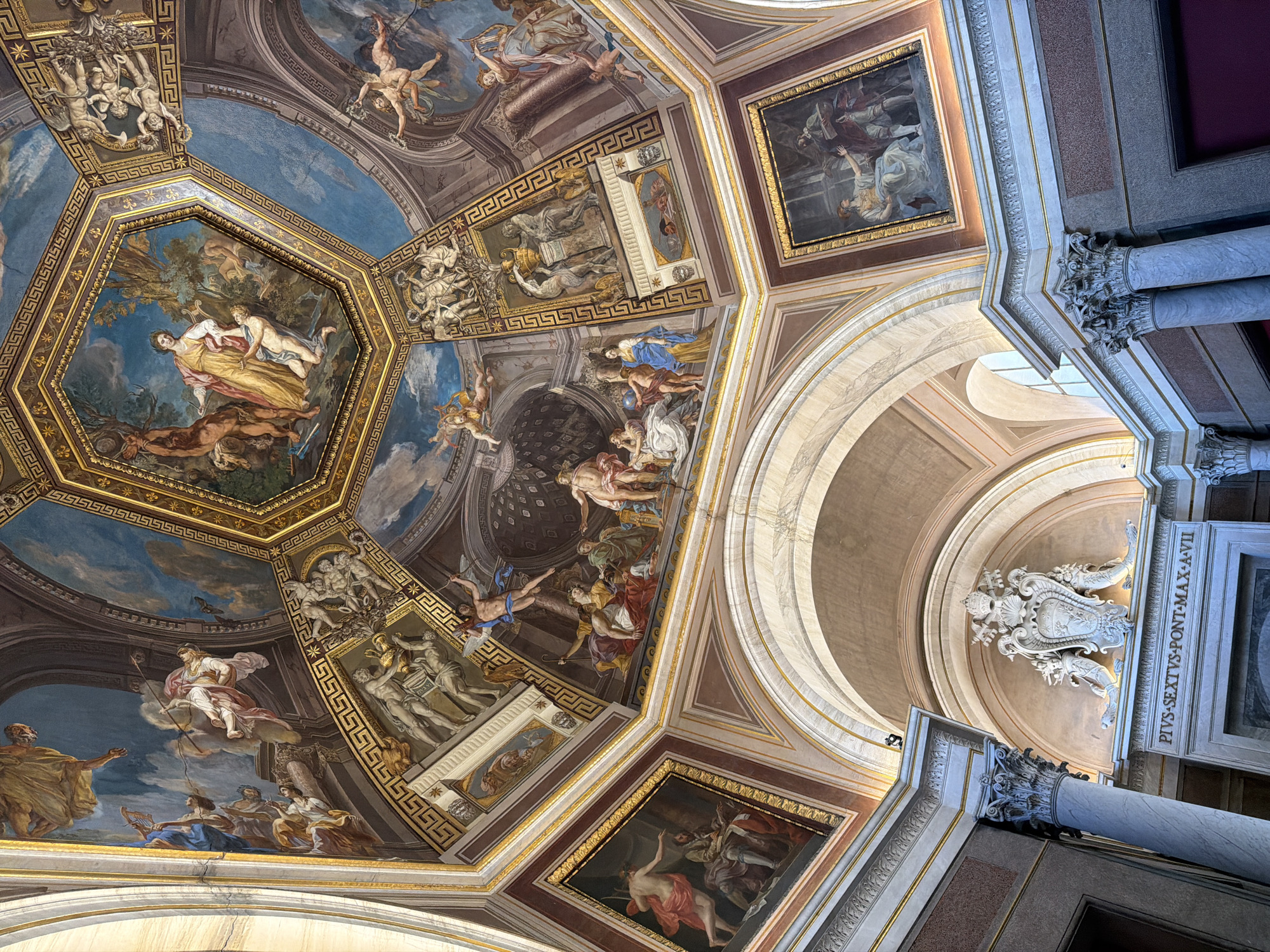 Ornate painted ceiling captured in Vatican City building