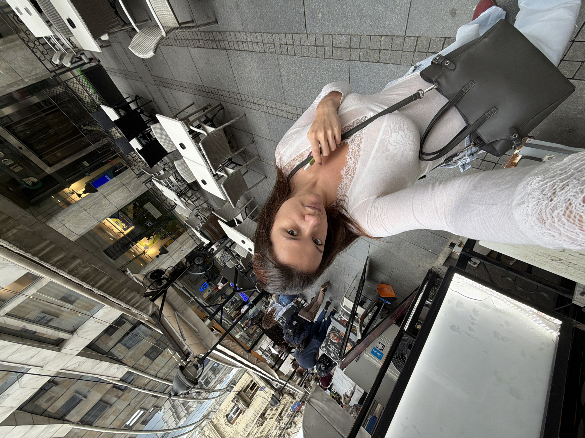 Woman takes selfies on Belgrade street and elevator