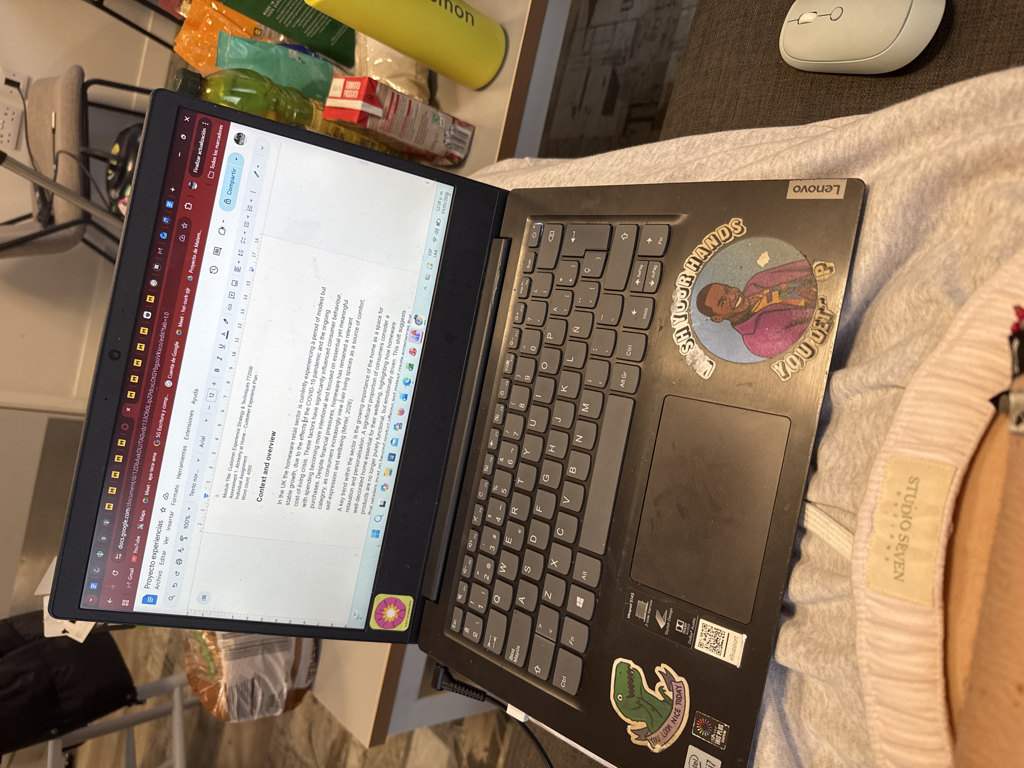 Home workspace documented in Hull showing laptop and cluttered desk