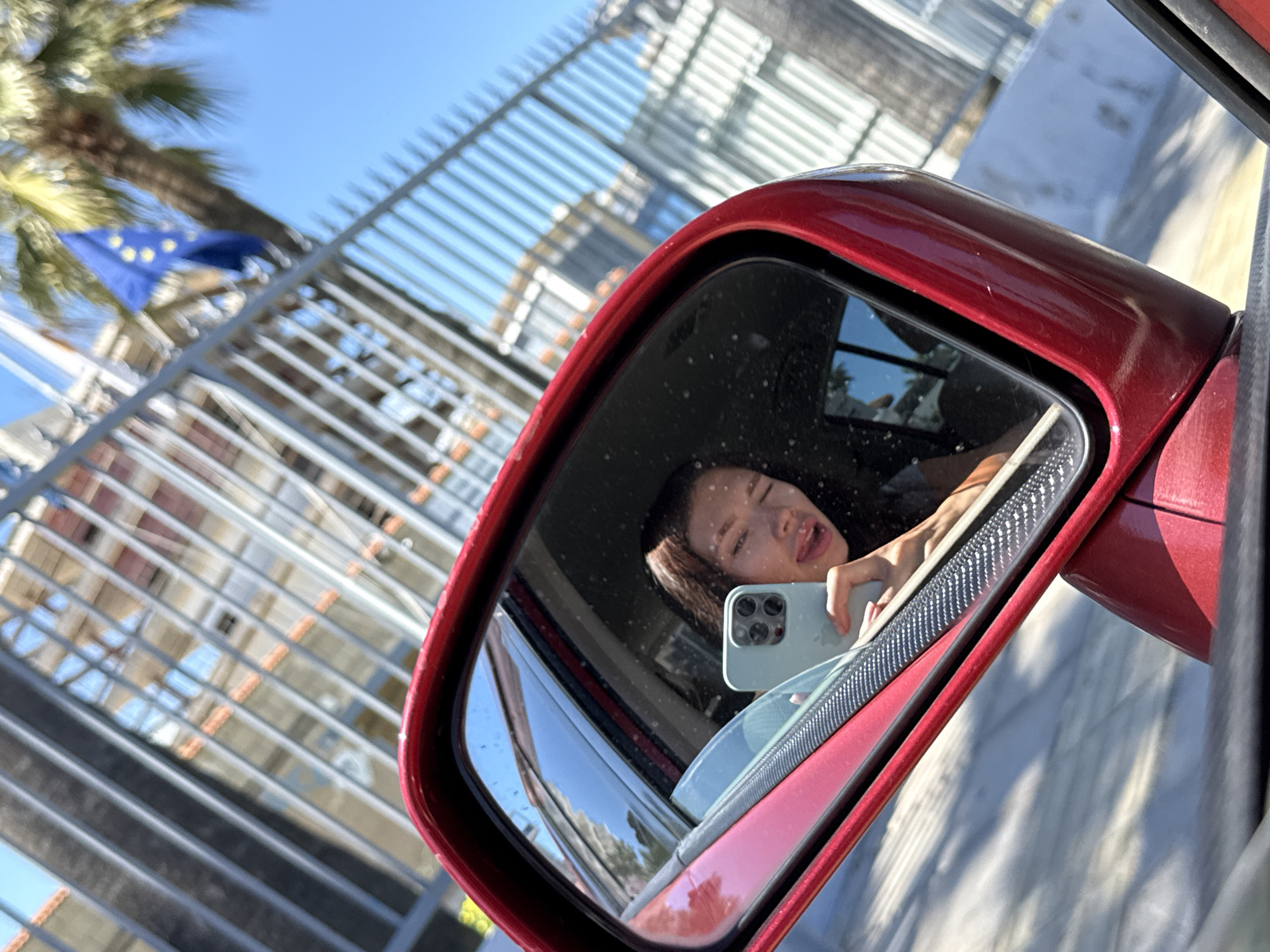 Woman photographed in car with smartphone in Larnaca