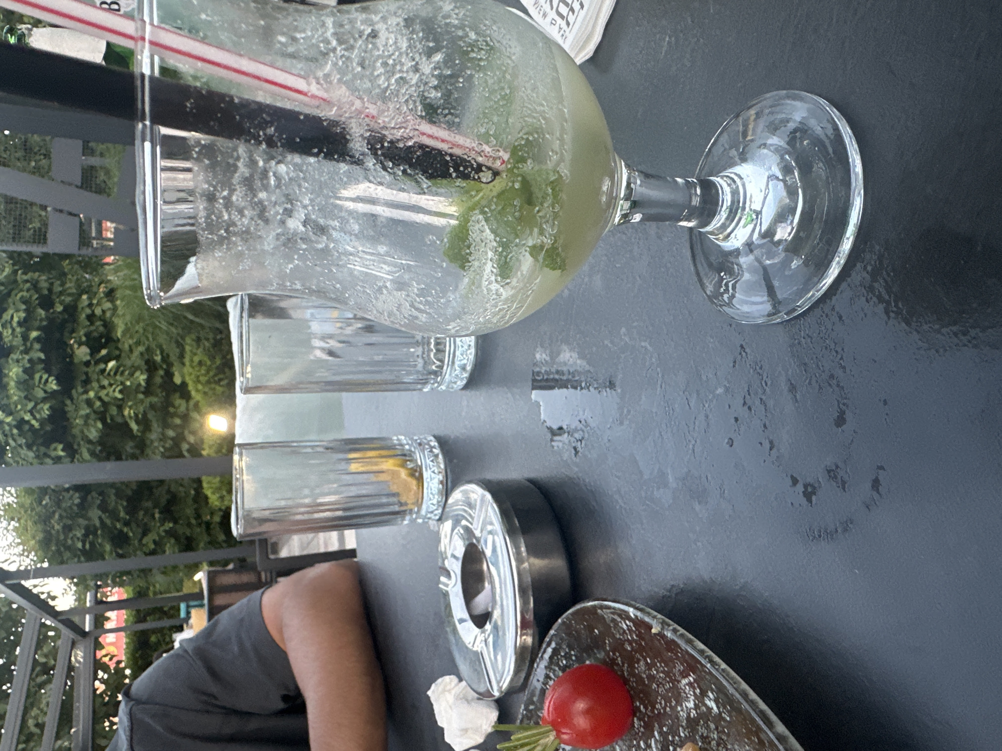 Casual outdoor hangout, drinks winding down