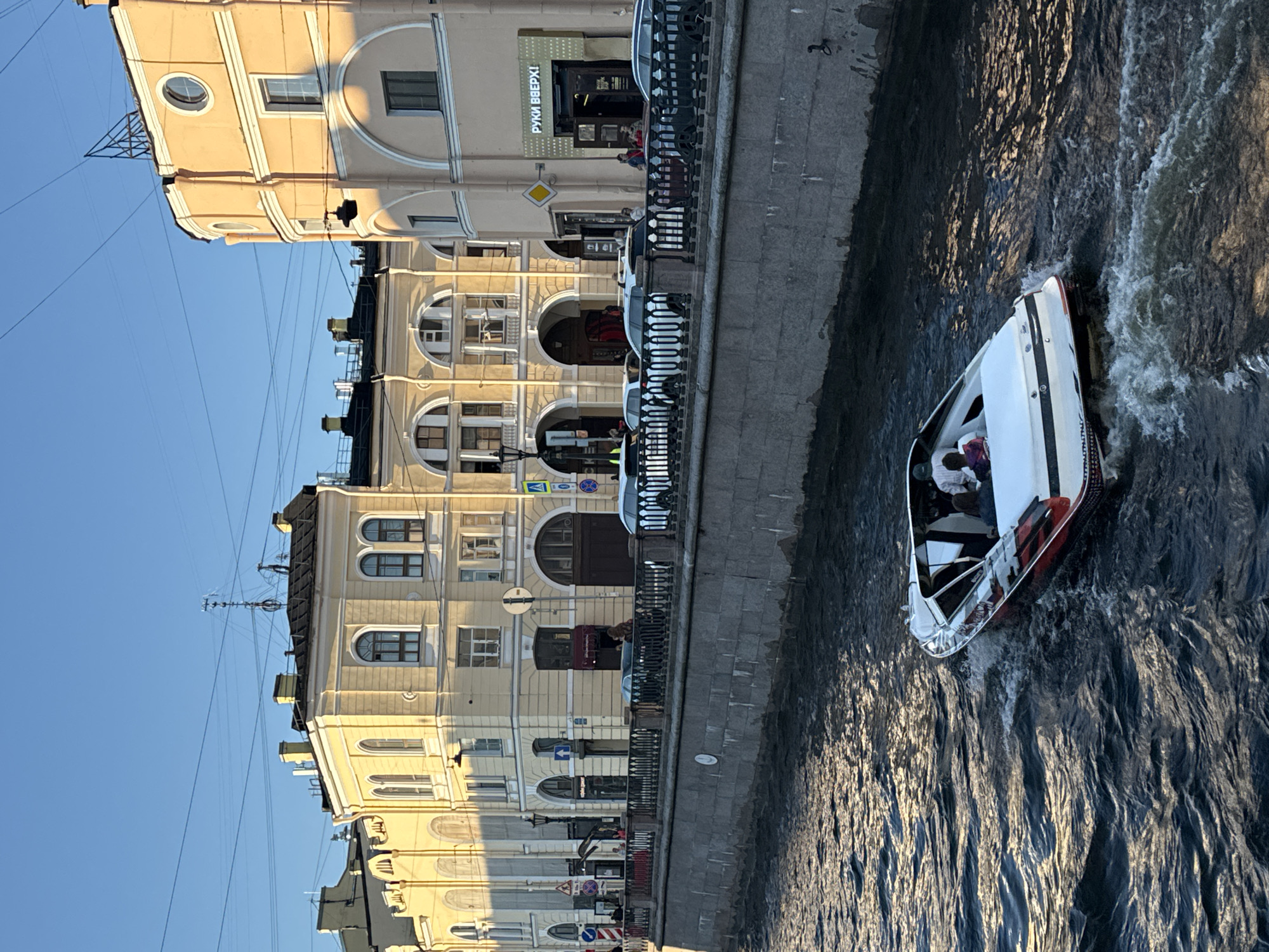 Evening life unfolds along Saint Petersburg's historic canals