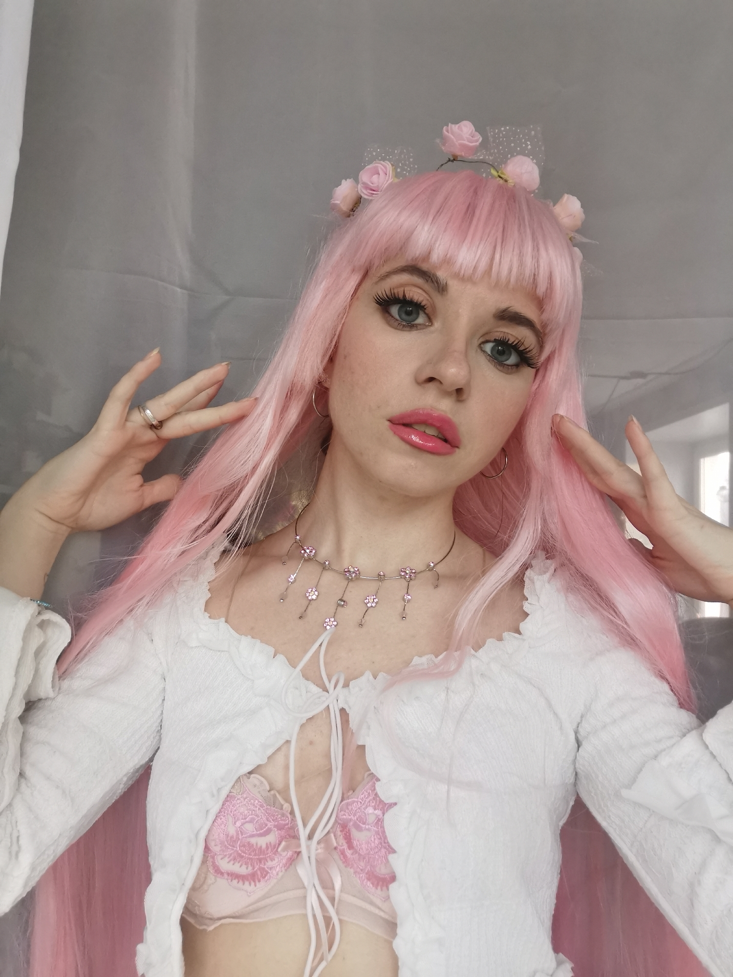 Woman in Pink Wig Poses for Photos