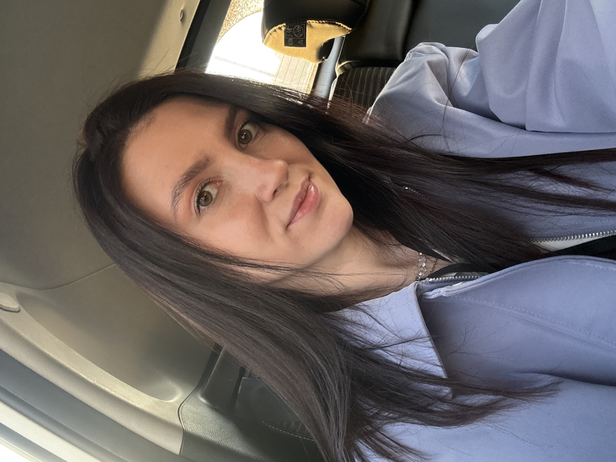 Woman takes car selfies in Kazan, Russia