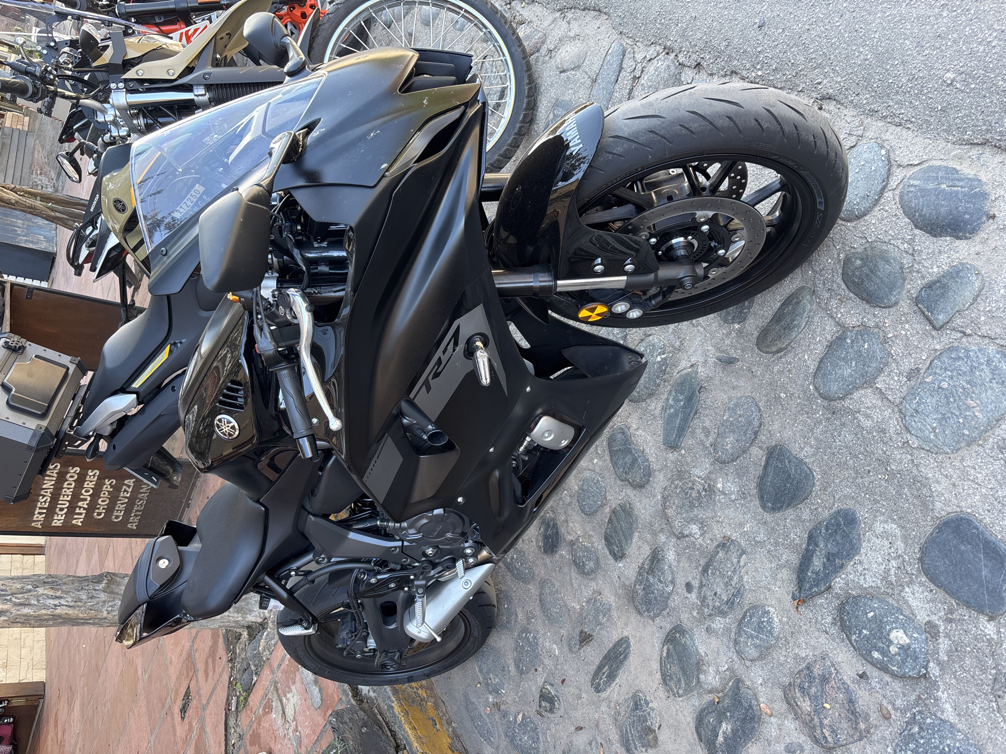 Black Yamaha R7 motorcycle spotted on cobblestones in Argentina