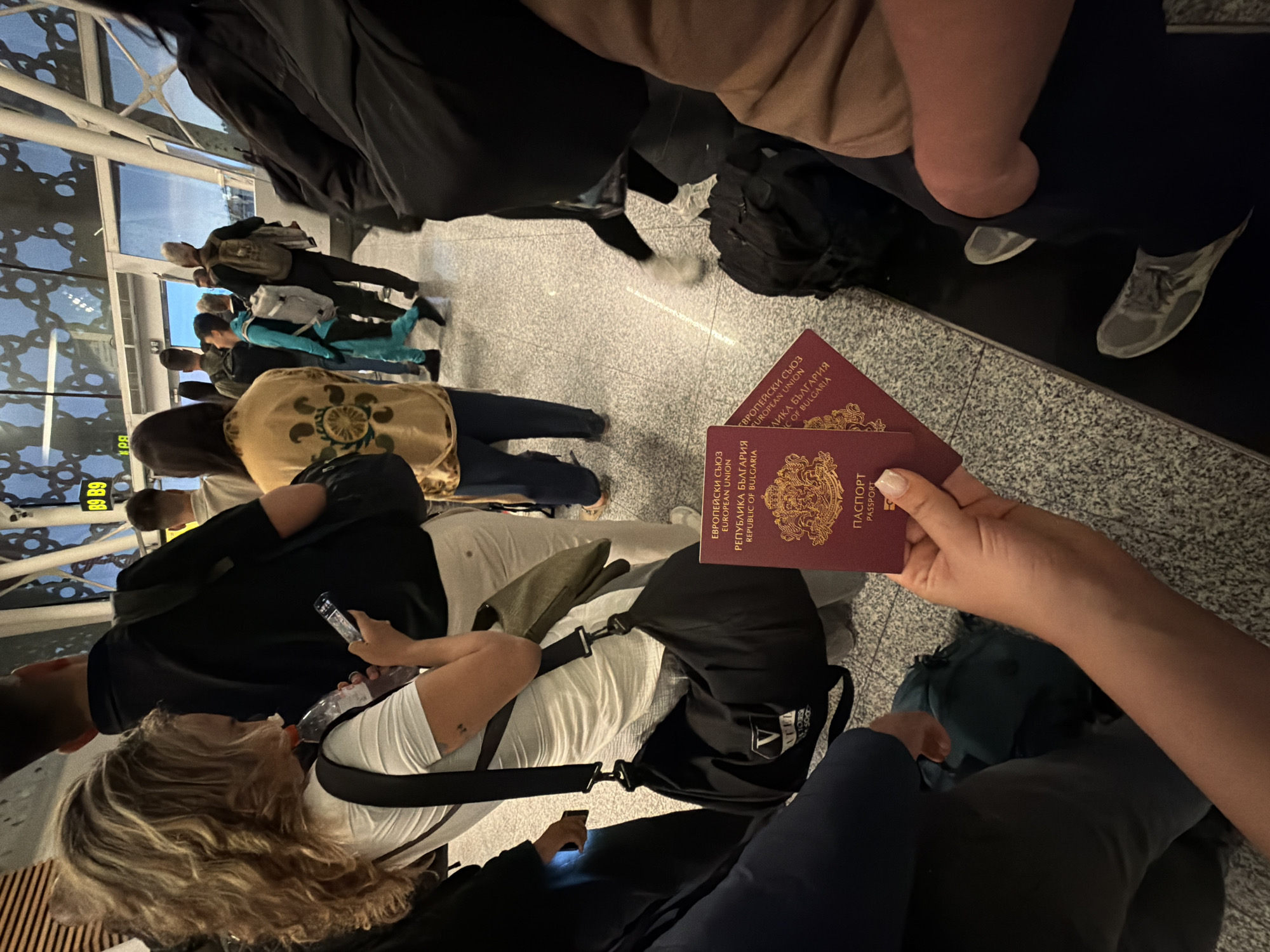Travelers with Bulgarian passports wait at Marrakesh airport terminal