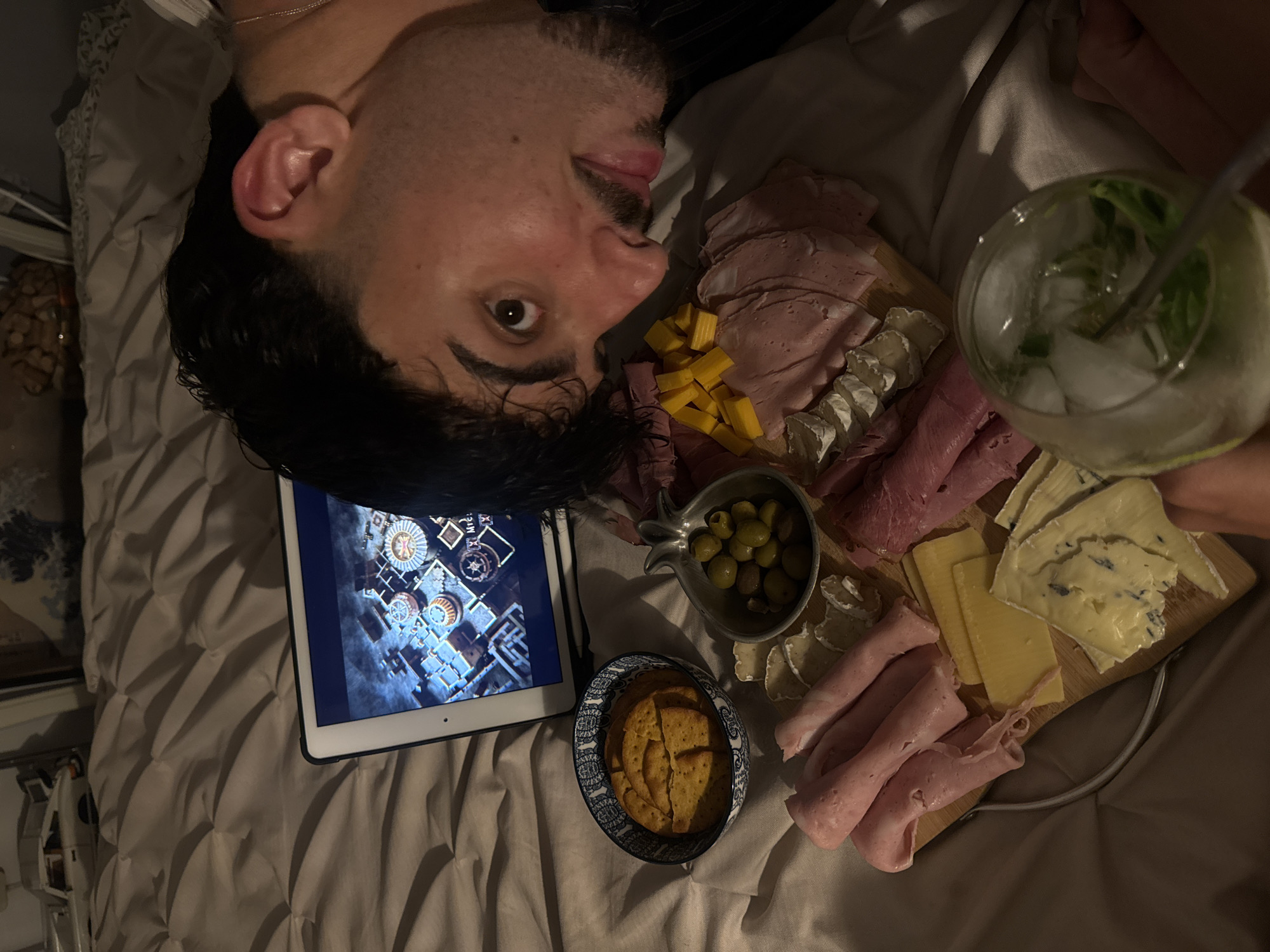 Charcuterie board and tablet for a chill Tel Aviv night in