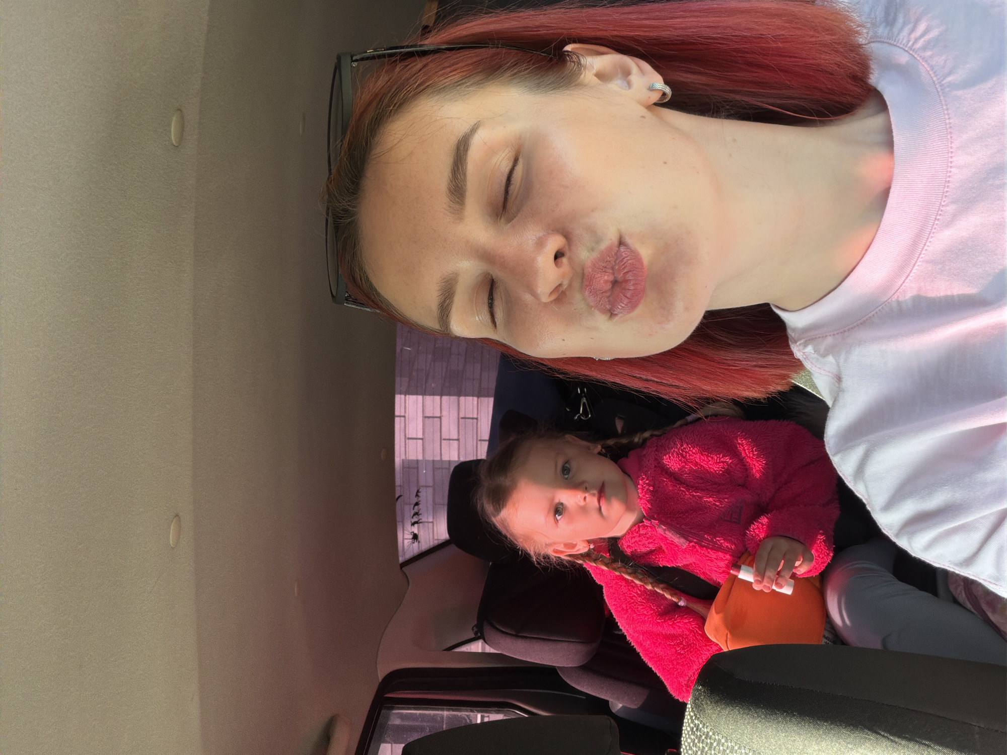Woman takes car selfies with child in Chaikovsky, Russia