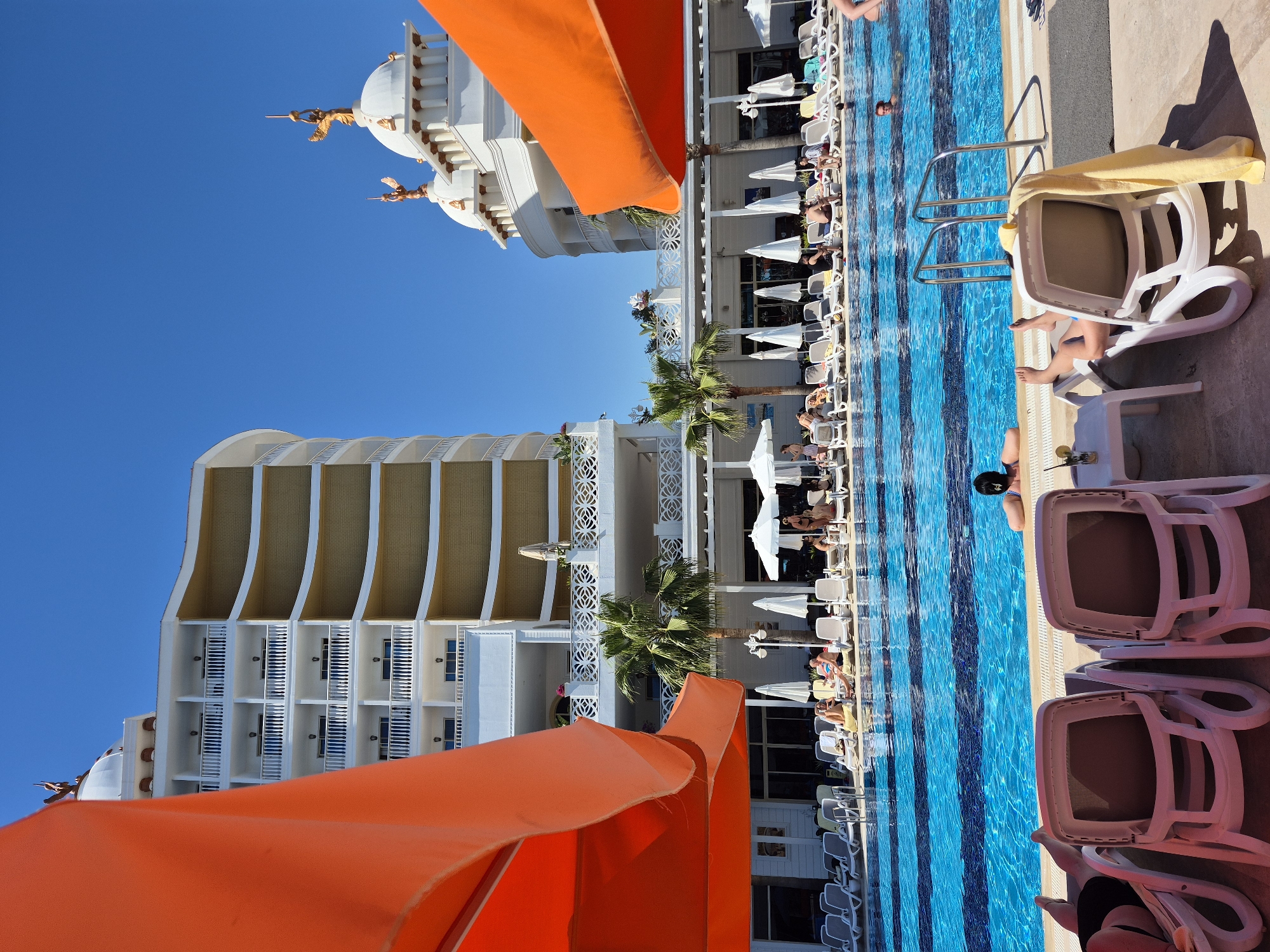 Resort guests enjoy typical poolside afternoon in Alanya, Turkey
