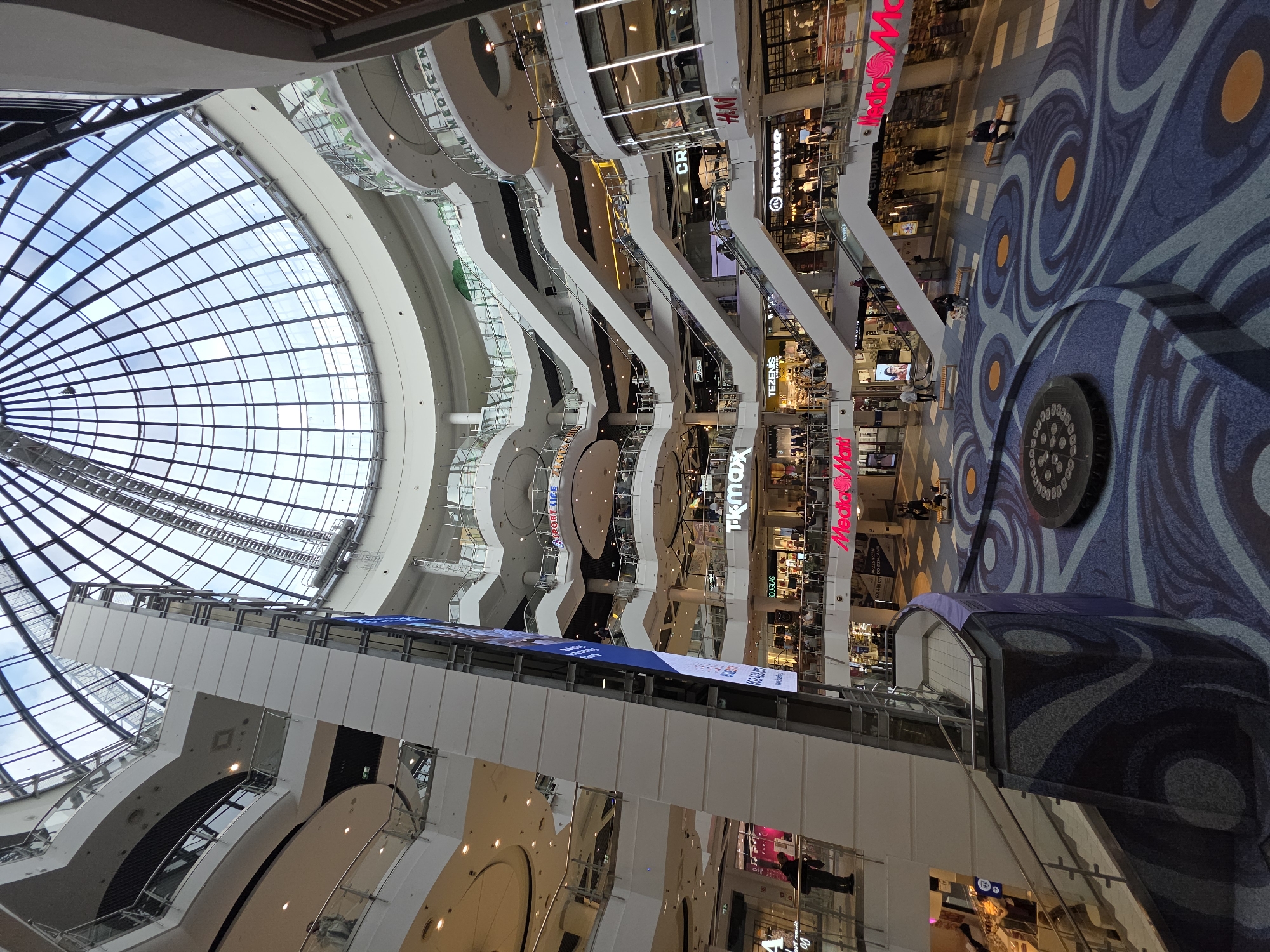 Shopping mall visit captures architecture, vendors, jewelry, flowers in Warsaw