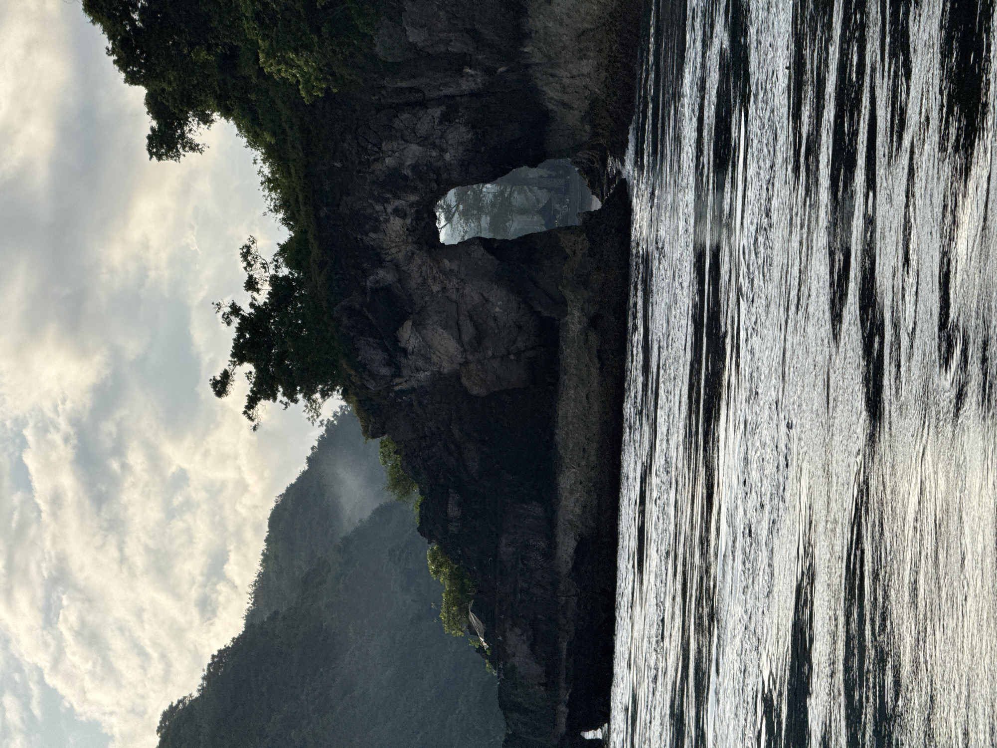 Natural cliff archway photographed off Nusa Penida coast