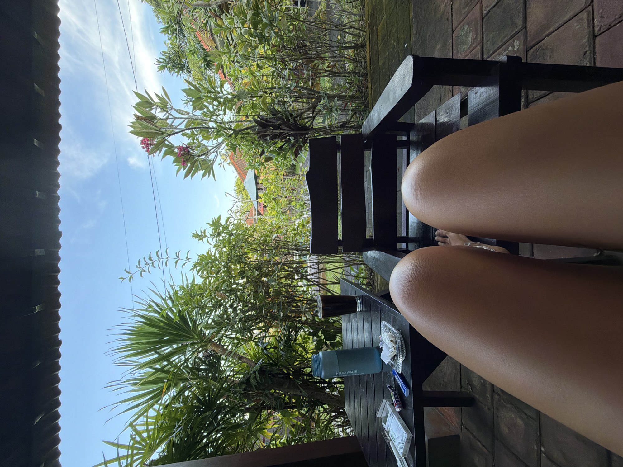 Person relaxes in garden setting in Kutuh, Indonesia