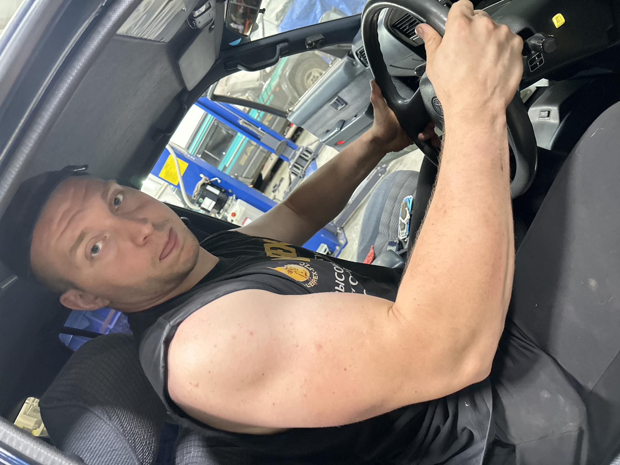 Car maintenance and a German Shepherd's chew toy session in Blagoveshchensk