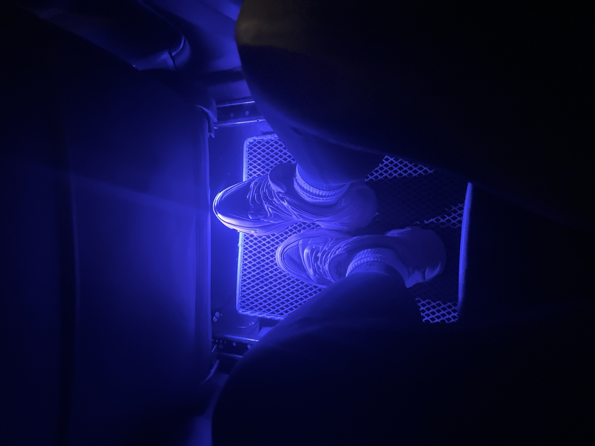 Person sits in LED-lit vehicle interior in Tyumen