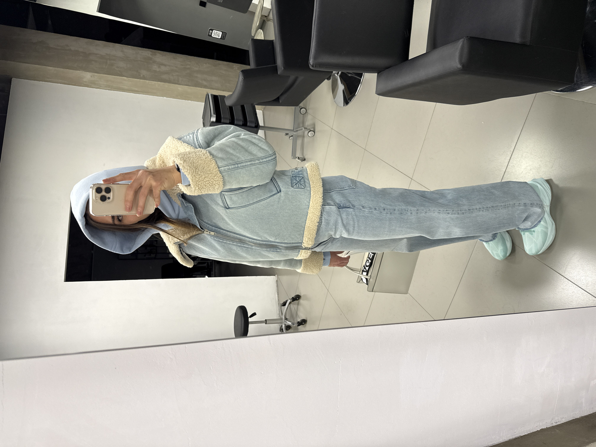 Woman takes selfies at Saint Petersburg hair salon