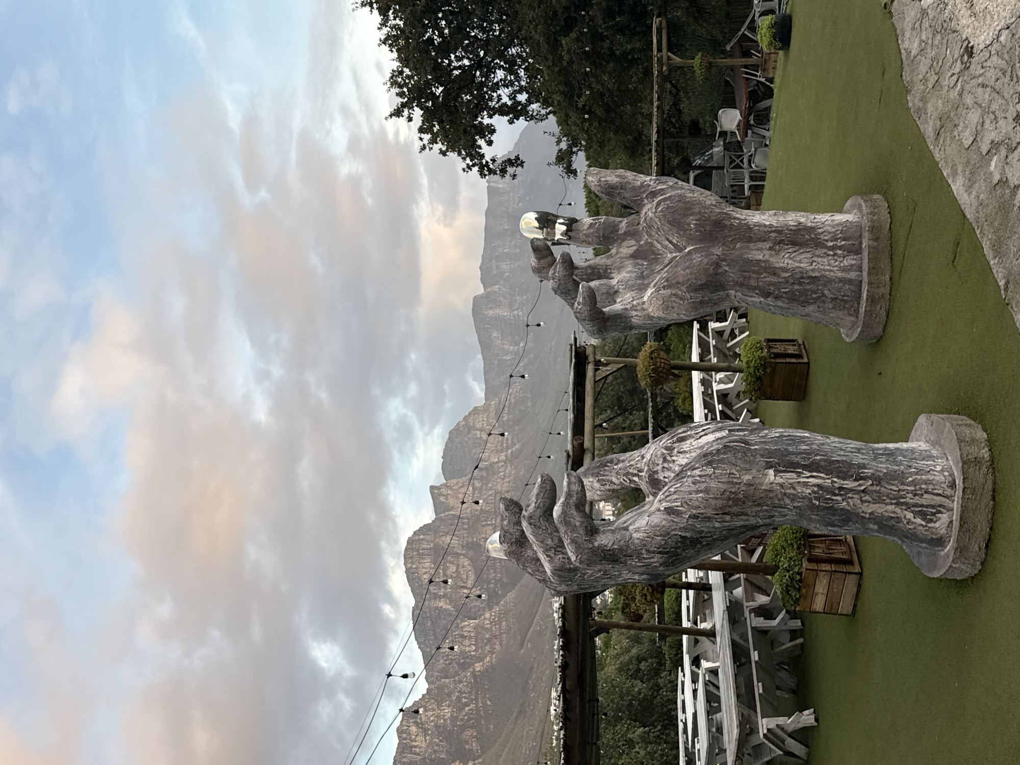 Stone hand sculptures with orbs documented at Cape Town venue