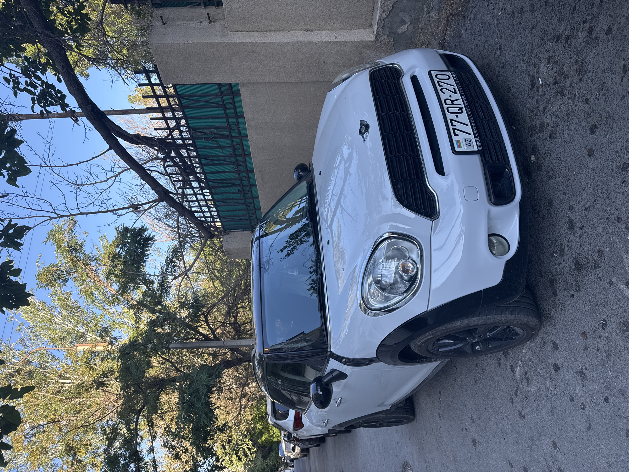 A diverse lineup of parked cars on a Baku street