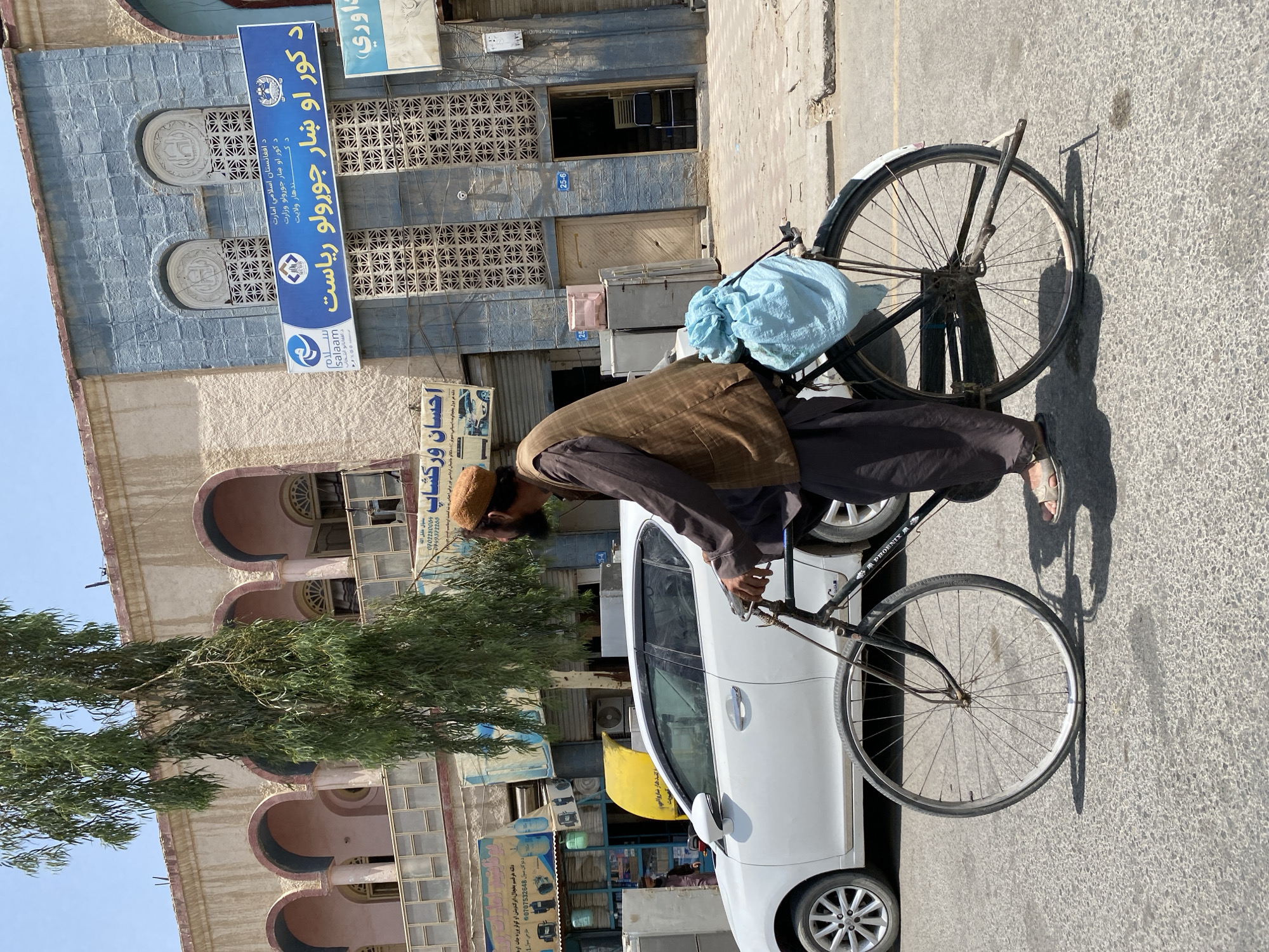 Cycling through Kandahar with bundled cargo