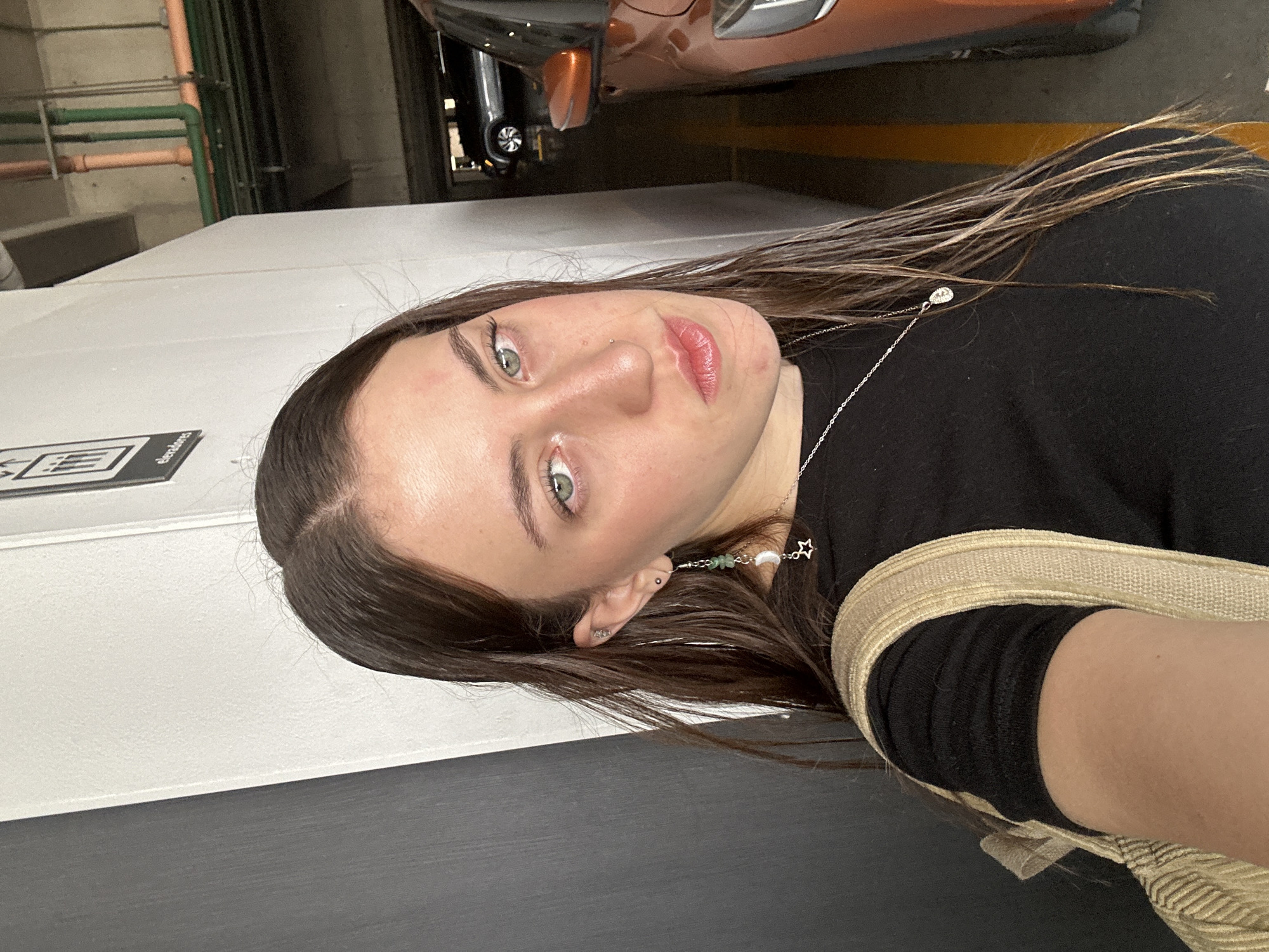 Woman takes selfie in parking garage in Huixquilucan