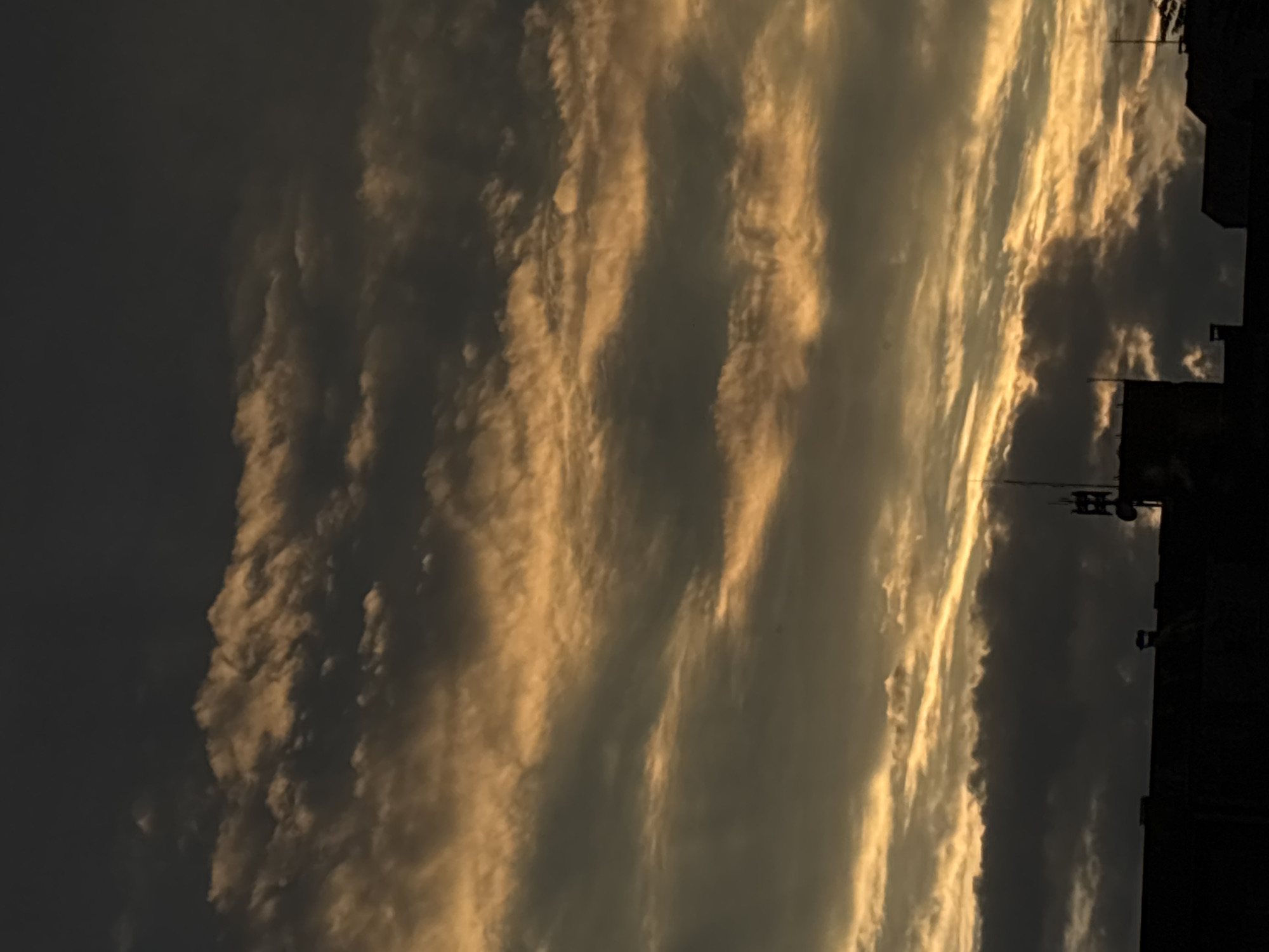 Golden sunset clouds shot from multiple angles in an urban setting.